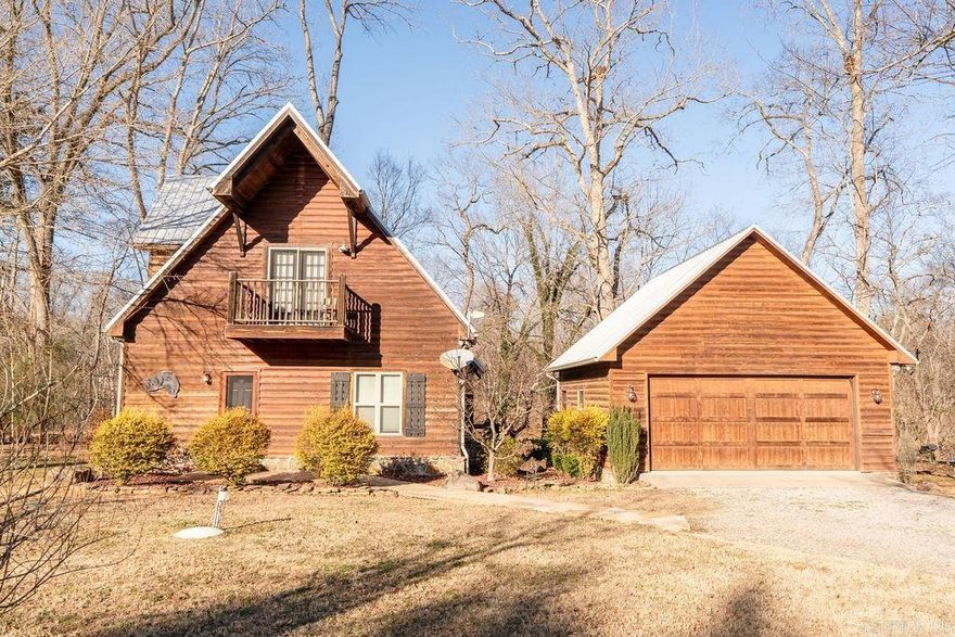 Welcome to your perfect river escape! This charming 2-bedroom, 2-bath cabin with a private boat dock sits right on the banks of the Little Red River, offering peaceful water views, direct access for fishing or kayaking, and a cozy retreat surrounded by nature. Step inside to find a warm, inviting interior with an open living area, vaulted ceilings, and kitchen flows naturally into the living and dining spaces, making it ideal for family gatherings or weekend getaways. Both bedrooms are comfortably sized, and each bathroom is designed with convenience in mind—perfect for hosting guests or enjoying extended stays. Bedrooms can be easily reversed for primary on main level. Outside Enjoy TWO spacious decks—perfect for morning coffee, grilling, or relaxing to the soothing sounds of the river. As the sun sets, gather around the custom firepit for s’mores and stories under the stars. A rare perk for a river cabin, the 2-car garage offers plenty of space for vehicles, gear, tools, and river toys. Fully furnished and ready to go!   This would make a great investment property for rental income with river access just steps away from the property.  (Boat is not included)
