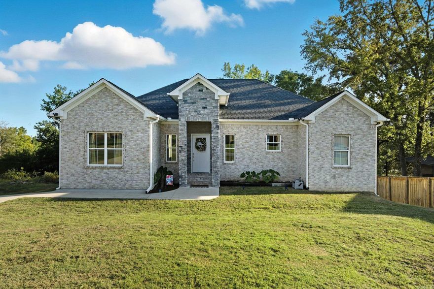Beautiful Home with a Country Feel on a Large Lot! Welcome home to this stunning property that perfectly blends modern finishes with a peaceful, country setting. The spacious great room features a vaulted ceiling with a striking wood beam, creating a warm and inviting atmosphere. The kitchen is a showstopper—featuring quartz countertops, a tile backsplash, and stainless steel appliances that make both cooking and entertaining a delight. The primary suite offers a relaxing retreat with a soaking tub, a large walk-in tiled shower, and plenty of closet space. Enjoy the beauty of nature from your large lot while still being conveniently close to town. This one is truly move-in ready—don’t miss your chance to make it yours!