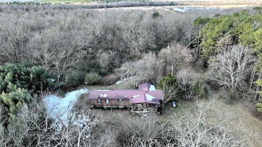 Nice property with a well, septic and power.  Close to town and private.  Mobile home is unlivable and on property at no value, and will not be removed by seller.  There are a couple of outbuildings.