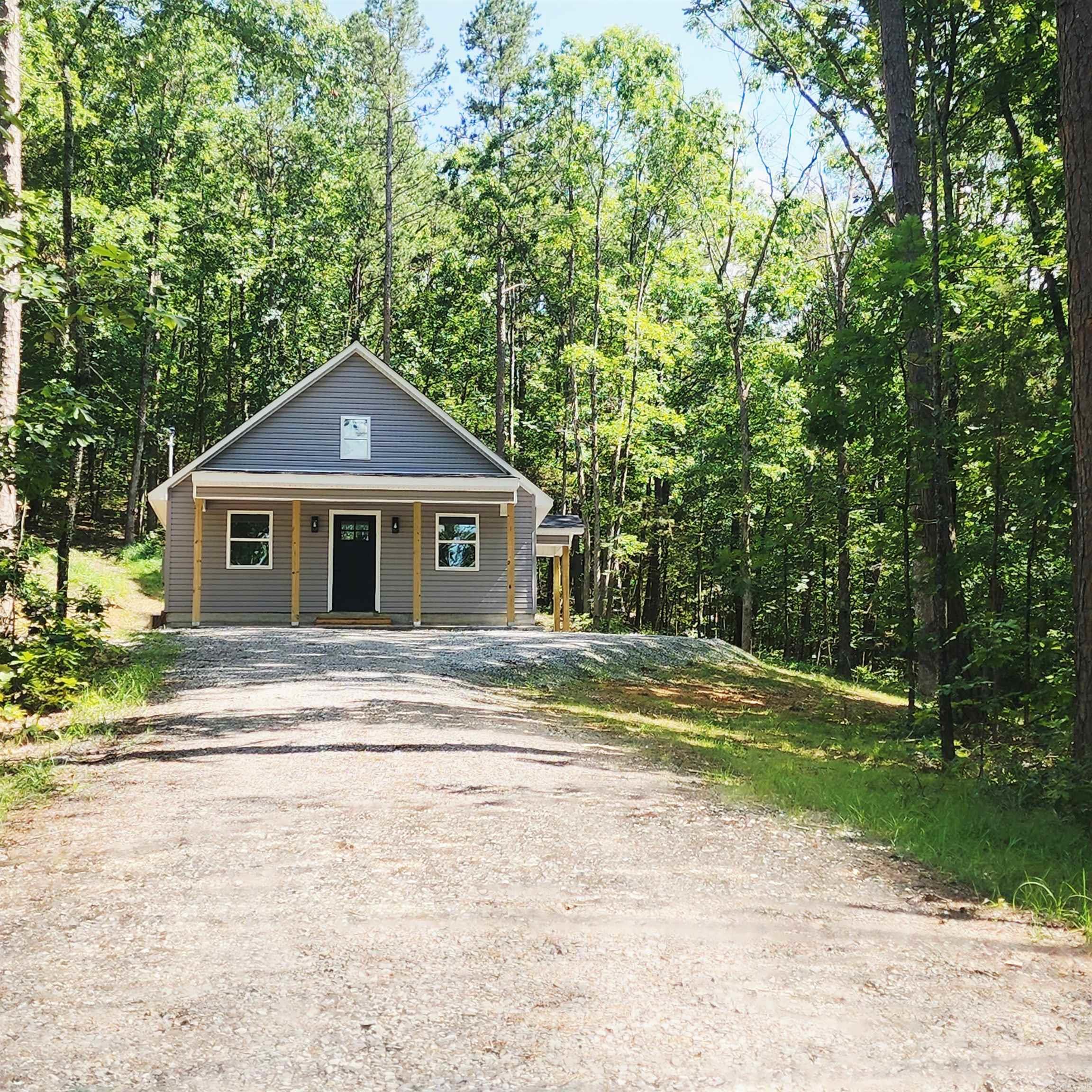 NEW CONSTRUCTION - Don’t miss this opportunity to own a beautifully built home nestled on a peaceful ½-acre wooded lot! This brand-new construction offers granite countertops in the kitchen, luxury vinyl plank flooring throughout the main level, and an open, inviting floor plan. Upstairs, a spacious loft provides flexible living space—ideal for a home office, craft room, or potential third bedroom. Spray foam insulation in ceiling. Love to fish? You're in luck! Located just 3.8 miles (5 minutes) from Libby Shoals Access on the Little Red River. Love lake time? You're just 12 miles to the Dam Site Recreation Area on beautiful Greers Ferry Lake. Whether you’re looking for a weekend retreat, a full-time residence, or an investment property, this home is priced to sell and ready for you! What are you waiting for? Schedule your showing today before it's gone! AGENTS SEE REMARKS