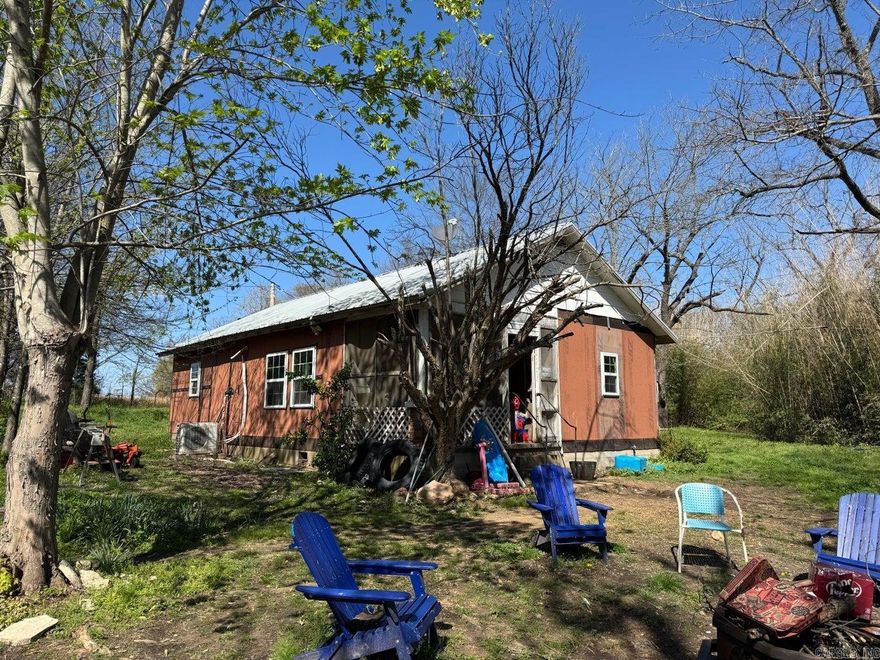 3 Bedroom, 1 bath home with open floor plan is just waiting on you to update and make it fit your taste. Home features a cozy kitchen, large primary bedroom with its own porch, and a dedicated laundry. Original hardwood flooring can be found in several rooms. This 4.17 +/-acres with highway frontage has a level field ready for livestock.