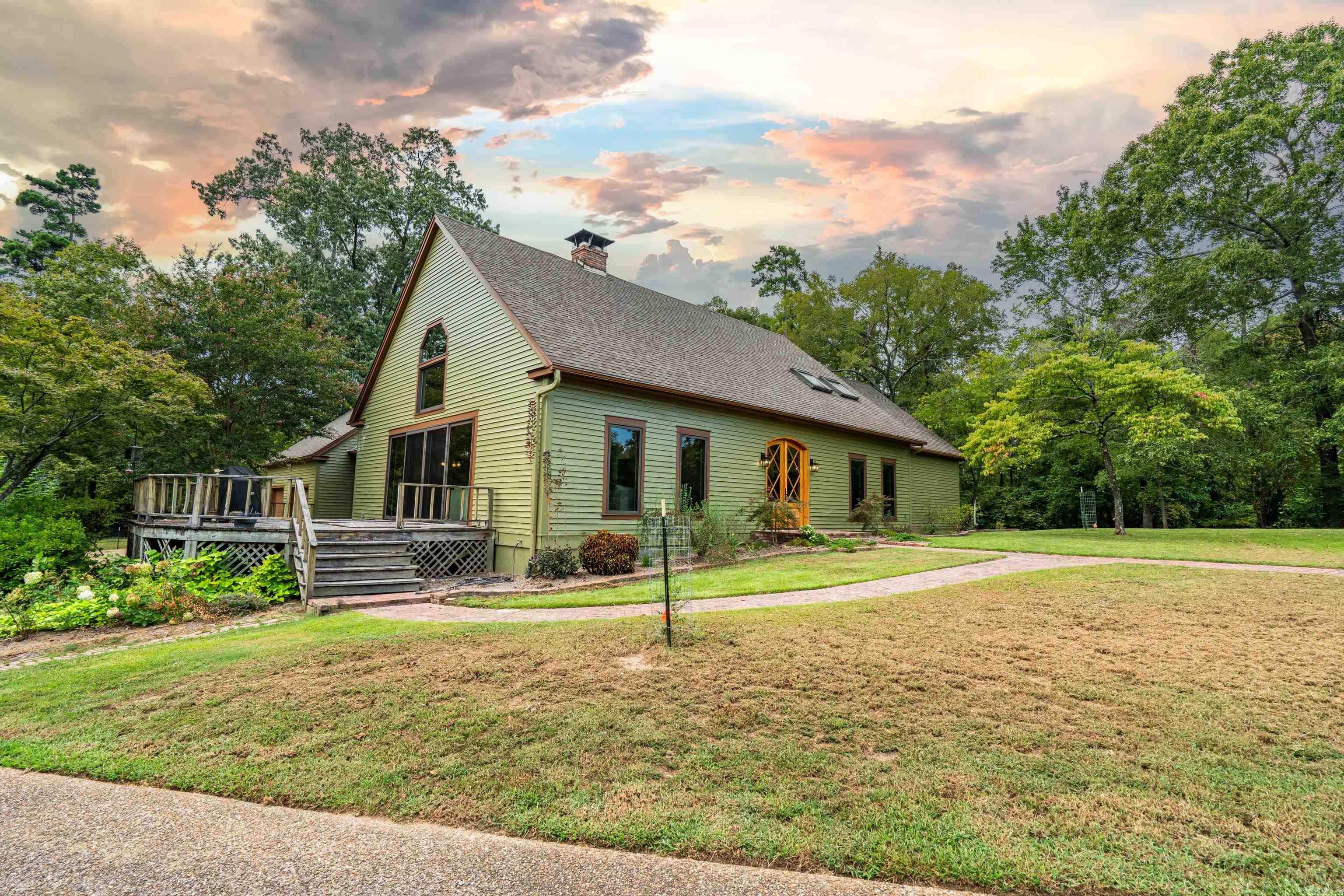 Welcome to 210 Fontana Road, a hidden gem offering privacy, space, and unmatched convenience inside the city limits. This TimberFrame Constructed home features 4 bedrooms, 3 full baths, and 2 half baths within 4,198 sqft +\- and sits on just over 12 acres in the highly sought-after Lakeside School District. Just 2 minutes from Hot Springs Country Club and a short drive to Oaklawn, shopping, dining, and a private access to the Hot Springs Creek Greenway Trail, this property combines the best of city living with the peace of a lodge style retreat. A slice of nature with abundant wildlife, pole barn, and separate gated entrance. Acreage, location, and space rarely come together in one packageādonāt miss this opportunity to own a private retreat with all the perks of Hot Springs at your doorstep!