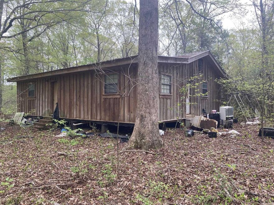 Great investment property that sits on 8.95 acres with a small pond and creek.  Ideal for hunting, and riding your ATV's.