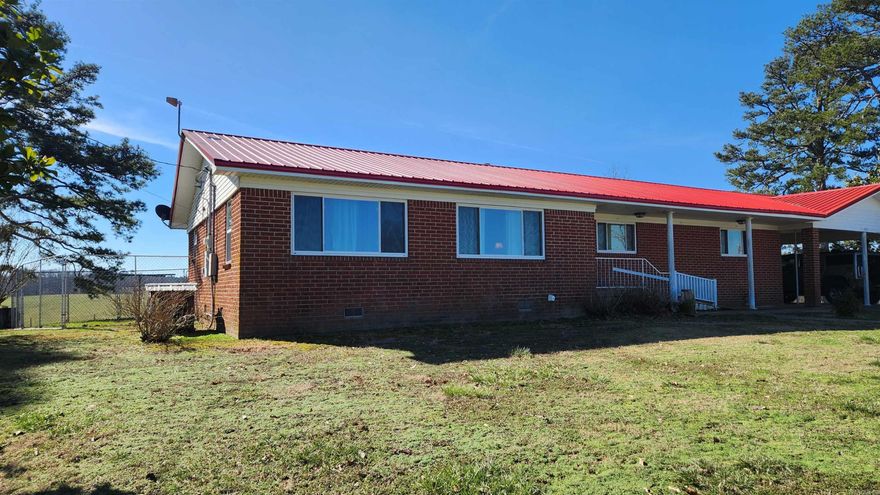 3 bedroom 2 bath brick home with attached carport on 1.54 acres. If a quiet country feel is what you are looking for in a place......then this property is the best place to start. Original hardwood floors. Large bedrooms. Walk-in tub. Newly remodeled kitchen. Updated windows. Metal roof. Low maintenance. All appliances convey. Wheel chair accessible. On-demand water heater. Pet fence out the back door. Garden spot. CHA and gas logs. 20x28 workshop/storage building. And let me tell you......the view out of the dining room window is my favorite. Call today to take a tour.