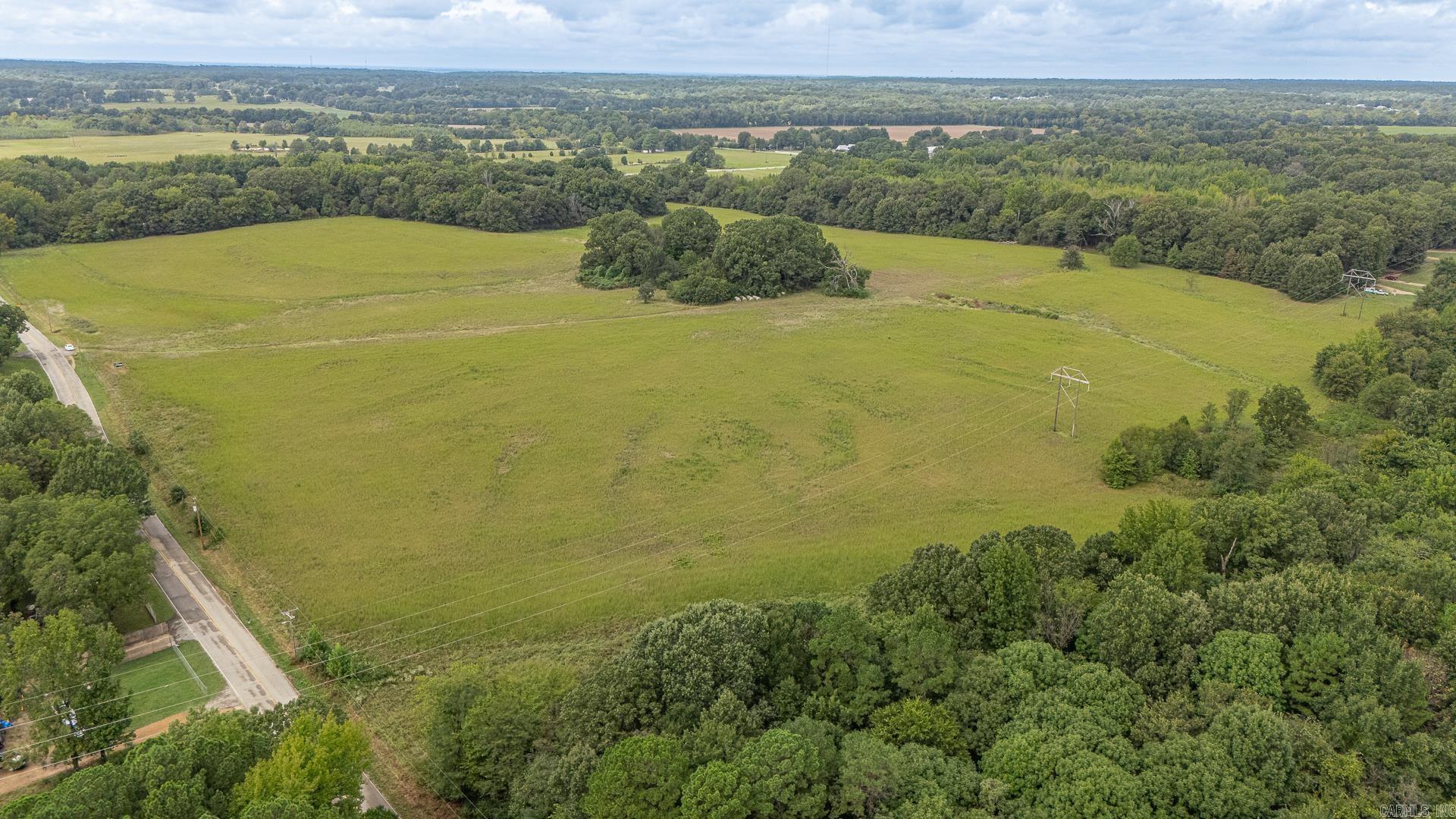 Nearly 24 acres of peaceful countryside with a mix of open pasture and mature trees, This property is perfect with endless possibilities. Road frontage, with utilities nearby. This beautiful land in Jonesboro is ready for your dream home, hobby farm, or investment project.