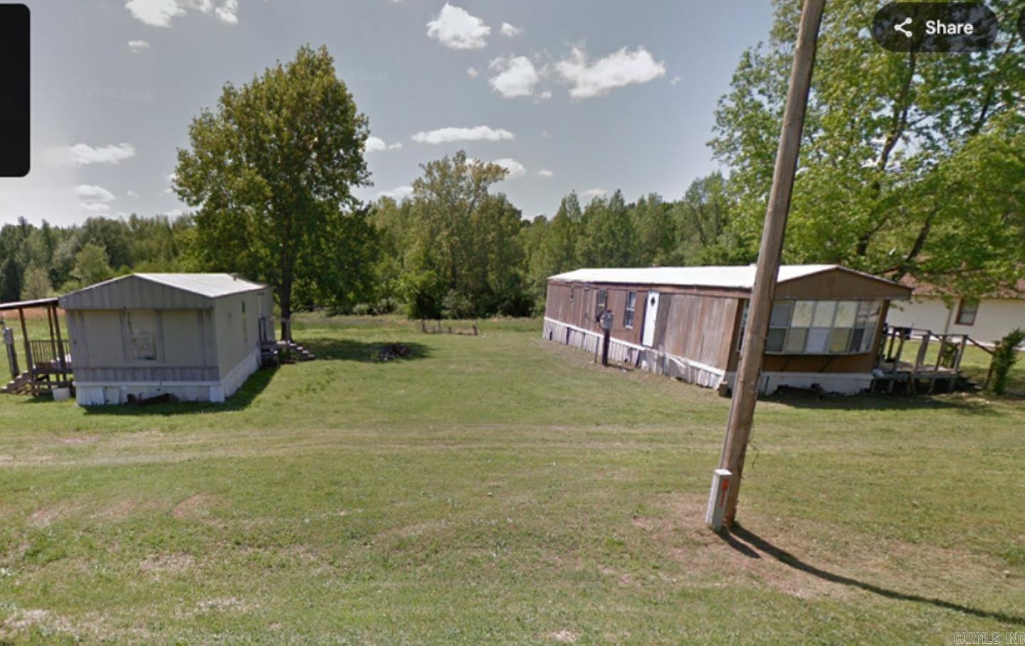 Established Mobile Home Park with approximately 19.28 acres that includes 11 mobile homes spaces with hook ups. 8 mobile homes included in sale along with 3 leased spaces. City water with 2 meters, electric, natural gas, and septic tanks. Tenants pay for all utilities except water and garbage. Property also has a concrete storm shelter. Property has great potential and room for expansion or new construction with no Zoning in the county. Easy access from I-530 at Pratt road or Hwy 365 Arch Street Pike. Located in Landmark area off of Bracy Road.
