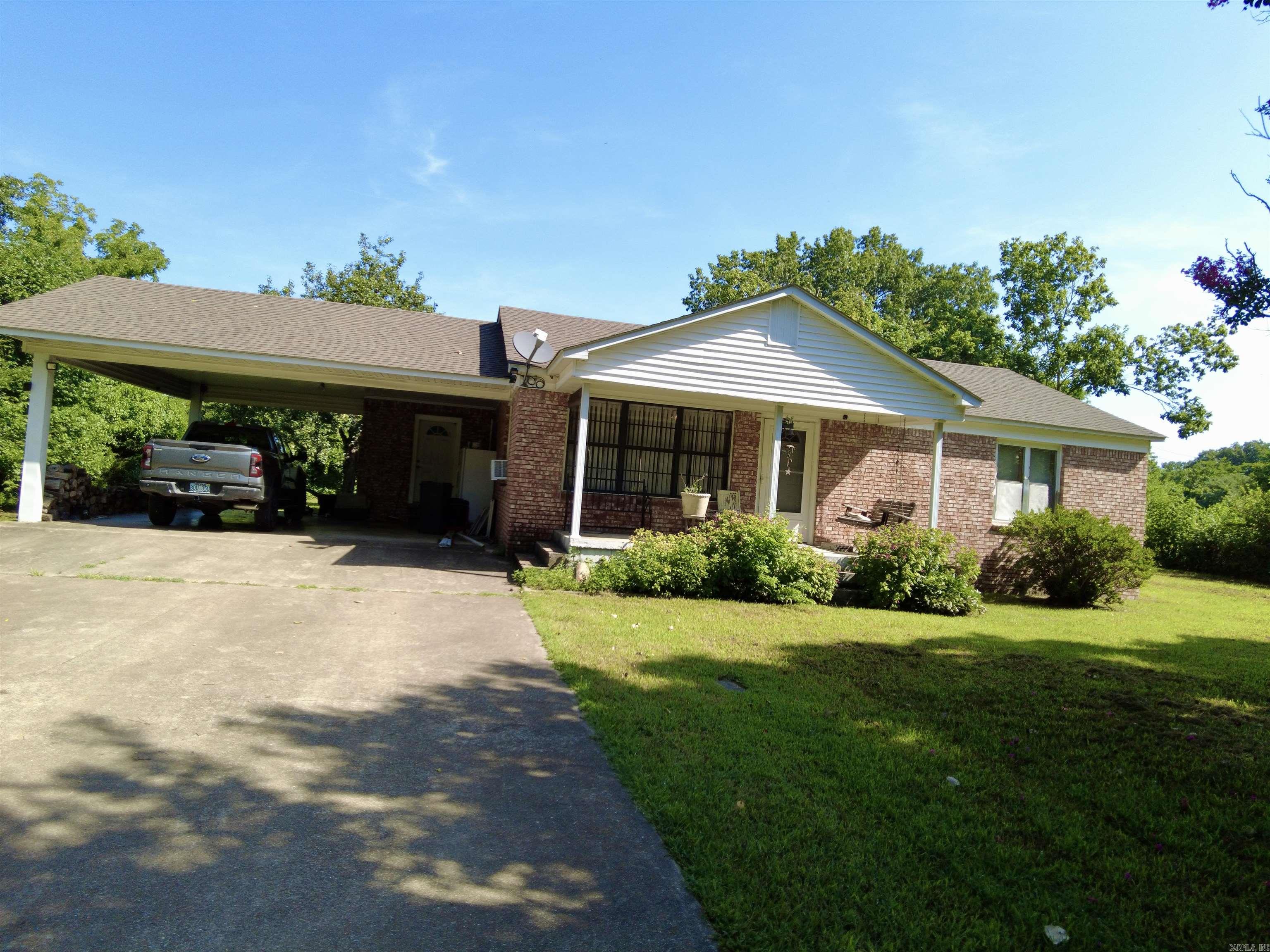 Charming 2 Bed, 2 Bath Brick Home ā Highway Frontage! Discover country living with modern convenience in this 2-bedroom, 2-bath brick home situated on approximately 2.25 acres m/l to be determined by new survey. Featuring a spacious 2-car carport, this property offers the perfect blend of comfort, functionality, and room to grow. Enjoy peace of mind with a dedicated storm cellar and ample storage in the included outbuilding. With highway frontage, access is a breeze, yet the expansive lot provides plenty of privacy and space for a garden, a few animals, or just soaking in the outdoors. Whether you're starting out, downsizing, or looking for a homestead-ready retreat, this home checks all the boxes. Donāt miss your chance to own this versatile property with room to make it your own!