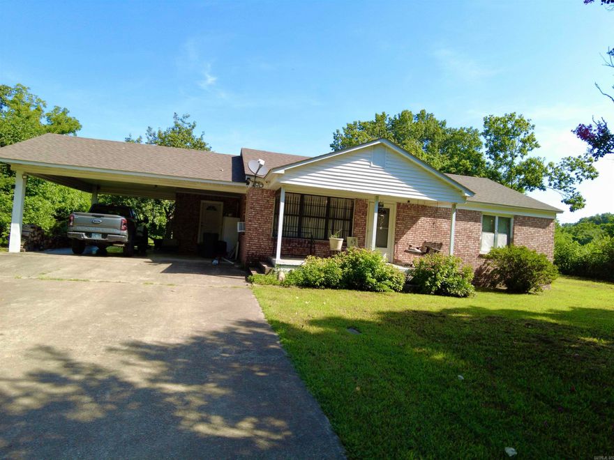 Charming 2 Bed, 2 Bath Brick Home – Highway Frontage!  Discover country living with modern convenience in this 2-bedroom, 2-bath brick home situated on approximately 2.25 acres m/l  to be determined by new survey. Featuring a spacious 2-car carport, this property offers the perfect blend of comfort, functionality, and room to grow. This property has mature pear trees and black walnut tree.  Enjoy peace of mind with a dedicated storm cellar, new roof in 2023 and ample storage in the included outbuilding. With highway frontage, access is a breeze, yet the expansive lot provides plenty of privacy and space for a garden, a few animals, or just soaking in the outdoors.  Whether you're starting out, downsizing, or looking for a homestead-ready retreat, this home checks all the boxes. Don’t miss your chance to own this versatile property with room to make it your own!