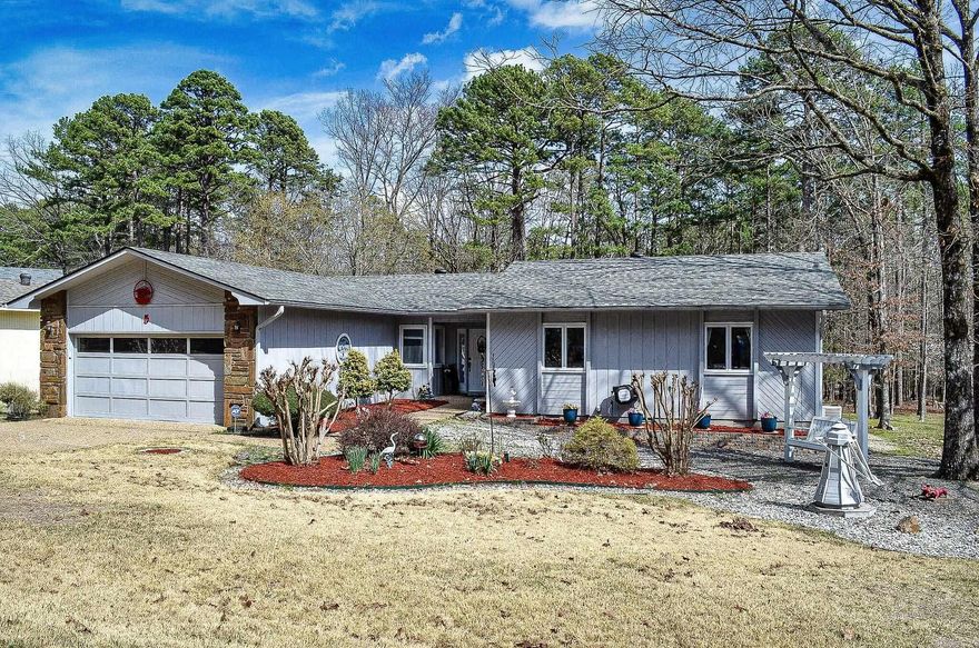 Easy living lifestyle....This 3 bedroom 2 bath ranch is just the home for you.  Nicely updated with laminate floors, wood burning fireplace and fenced yard. Level lot with fuss-free landscaping. Eat in kitchen, vaulted living/dining room and primary suite with tub/shower, tile floors and walk-in closet. Roomy garage with added storage. Hot Springs Village Property Owners Association has a new member buy-in fee of $2,000.00 due and collected at closing.