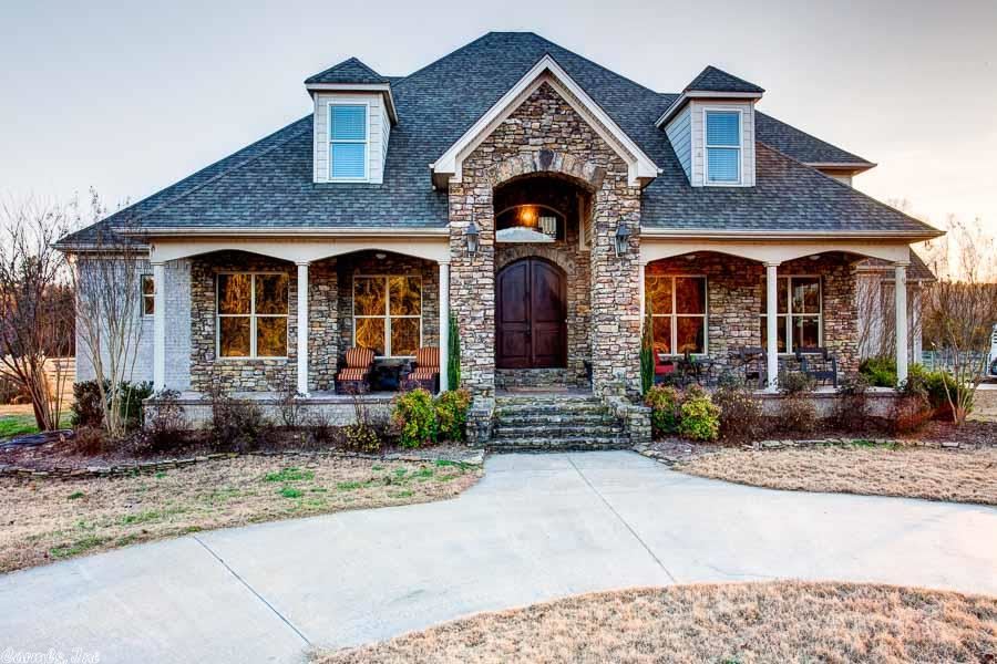 Custom Built by Richard Harp this ten acres estate enjoys spectacular views of Pinnacle Mountain and Rattlesnake Ridge. Main level features a great room with fireplace, family style dining room, office, large master suite with sitting area and wonderful spa like bath. Upstairs features a media/play room, four bedrooms, two full bathrooms and an additional bonus area. Beautiful covered front porch and back porch. Two fenced areas w) metal barn with 3 stalls and tac room. Oversized three car garage.