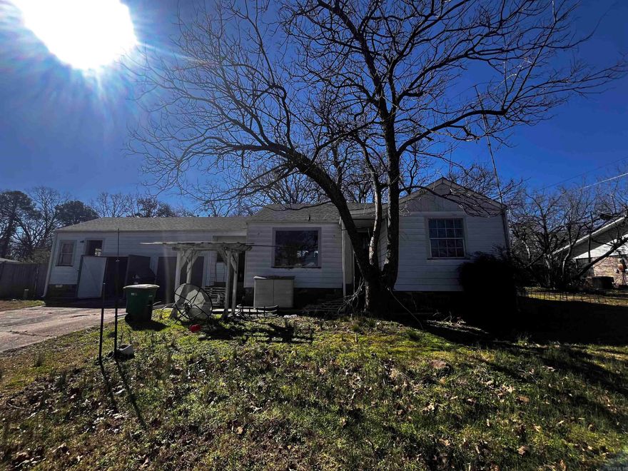 Investors take a look. This home has great bones and tons of possibilities. You could rezone for multifamily as the lay out is ripe for a duplex or flip it for single family. Huge lot with room to add! 2 bed 1 bath on the right side and it has a bonus room with half bath on left side. You could easily close in the garage and add 500+/-sf. Roof is only 2 years old! See agent remarks.