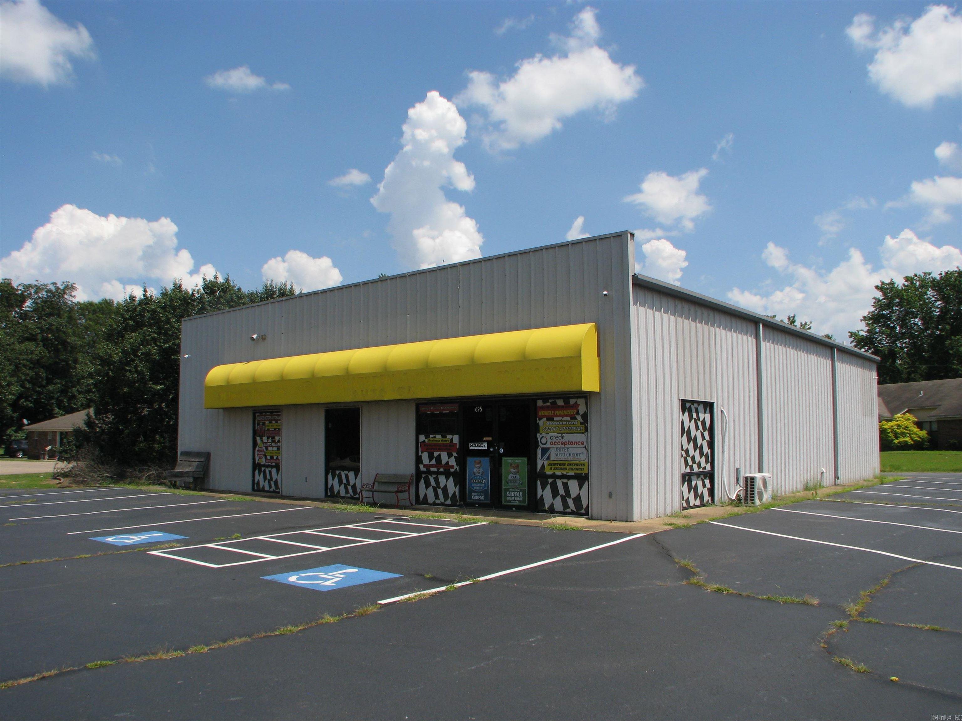 2,830 SF Building fronting W. Dewitt Henry Dr.! Site includes large parking lot with 60 paved parking spaces, 6 exterior light/poles with electric outlets along frontage. 40' wide Entrance allowing for semi-truck access. Building includes showroom, 4 private offices, kitchenette & restrooms plus shop. Shop is 1130 SF; heated with 14' sidewalls' and 16' center height, 3 (10' x 10') overhead doors & parts room. Building is outfitted with 6 outside cameras for surveillance & alarm system. Property has great visibility with quick access to I-57; Located next to Beebe Drug, Centennial bank & across from Unity Health. Call today for more information!