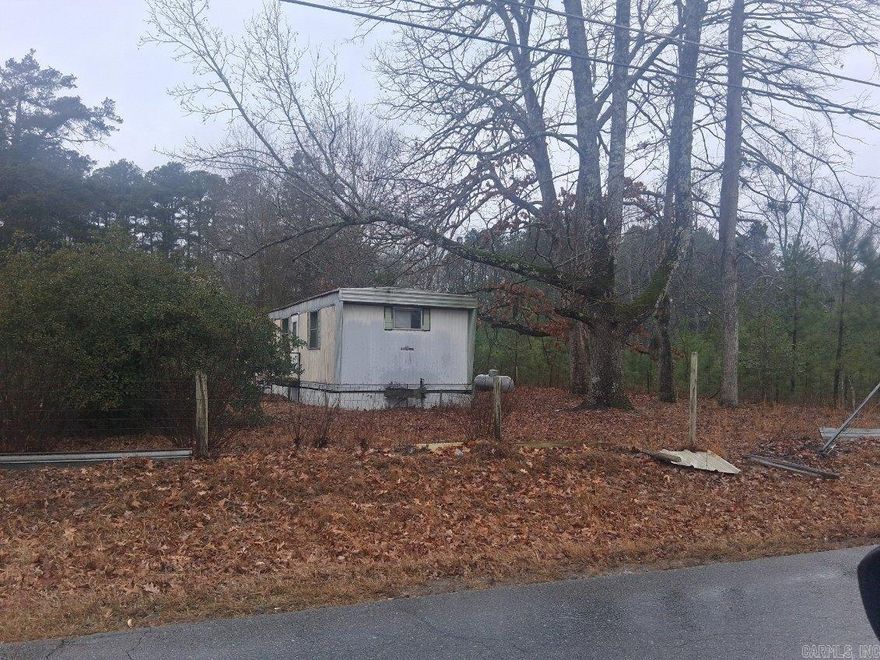 This is a wonderful five acre parcel of land, which can be utilized for building your dream home or some investment properties. Some potential projects are, residential new construction, transitional housing, assisted living facilities, recreational facilities or development for manufactured housing lot rentals. The property is located outside of the city limits and can qualify for rural development housing. There are two non-livable housing structures on the land. There are two septic systems located on the land, per the owner. The housing structures are being sold, “As Is”. Please call and schedule your appointment, as soon as possible! We look forward to working with you! You will be required to sign a , “Hold Harmless Agreement “,and wear a mask and protective clothing to enter the housing structures, due, to the possibility of mildew and mold.