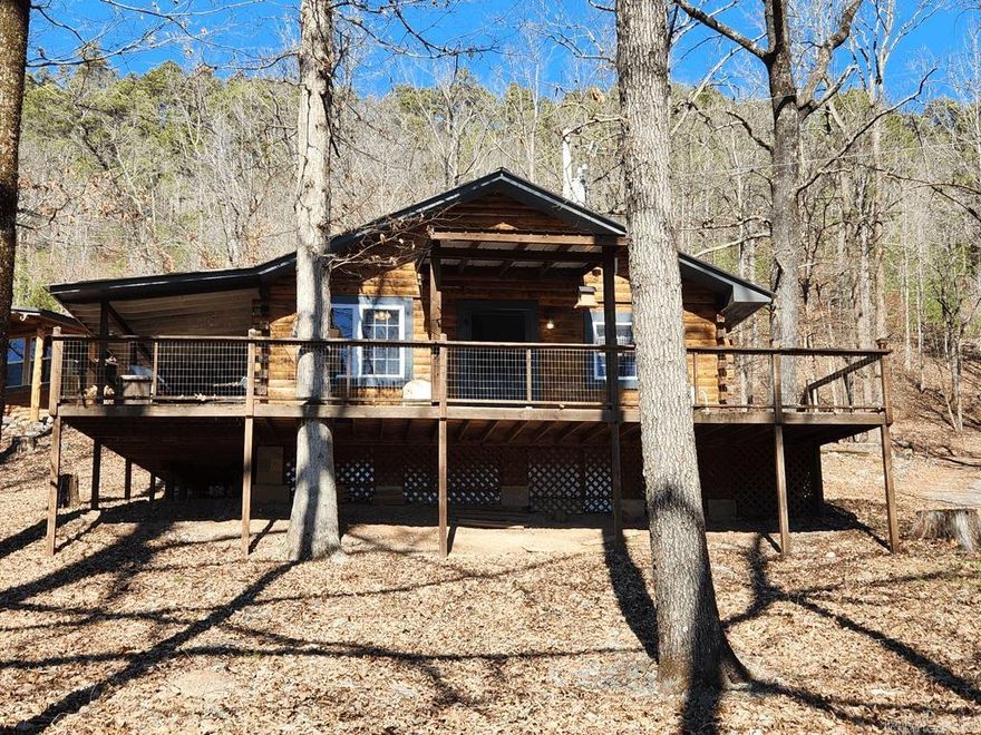 If you're looking for a bit of peace and quiet on the Caddo River then this may be the property for you! It includes three charming cabins nestled on 23 acres that border the National Forest on two sides with 1358 feet upwaters of the Caddo River bordering the property. You can sit on the porch with your coffee and enjoy listening to the river as you breath in the country air. With all the trees surrounding this property, it was a very private feel. There is a 41 x 30 shop with a concrete floor and roll up doors to house your ATVs, boats, or any storage that you may need. The property is located close to Albert Pike and Little Missouri Falls and is about thirty minutes from the picturesque town of Mena. This property has the potential to be income producing. You could live in the main cabin and rent out the other two or rent all three as an Air BnB or VRBO. There is also a small barn and very large fenced area that could work very well for a hobby farm. There is too much to mention everything this property has to offer. Call for your private showing today!