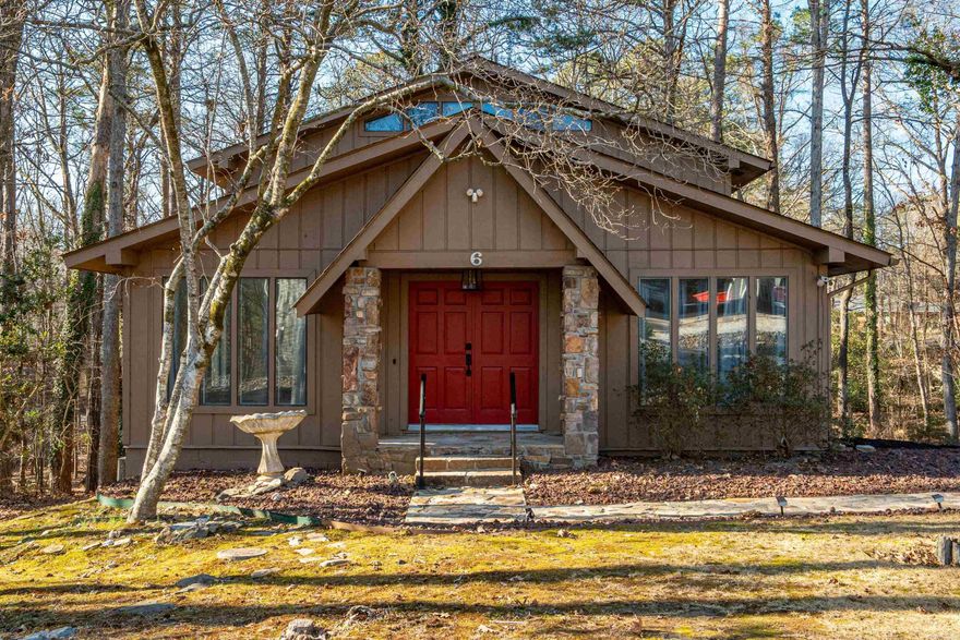 Check out this updated Lake Desoto area home with 2 Living areas, spacious kitchen and breakfast area, 3 Bedrooms, 3 Bathrooms plus a workshop room or crafting room! Perfectly positioned for a lovely wooded view of common property with 2 large decks to enjoy it! The main floor features a bedroom, bathroom, the Living and dining areas, kitchen, and Hearth room or living room that walks out on a spacious deck overlooking the woods! The top floor boasts an over-sized primary bedroom and bathroom en suite with large walk-in closet and spa bath with double sinks! Could function as kid's bunkroom or game room if you prefer main level primary bedroom! Downstairs is another area for an office or crafting area, bathroom, laundry room, and garage with access to another patio area. You will experience gorgeous views and plenty of space both inside and out! Experience the charm of Hot Springs Village living with restaurants, medical, shopping, 9 golf courses, 11 lakes for boating/fishing, 30 miles of walking trails, tennis, pickle ball, playgrounds, and more. Whether you’re looking for relaxation, recreation, or both – it’s all right here.