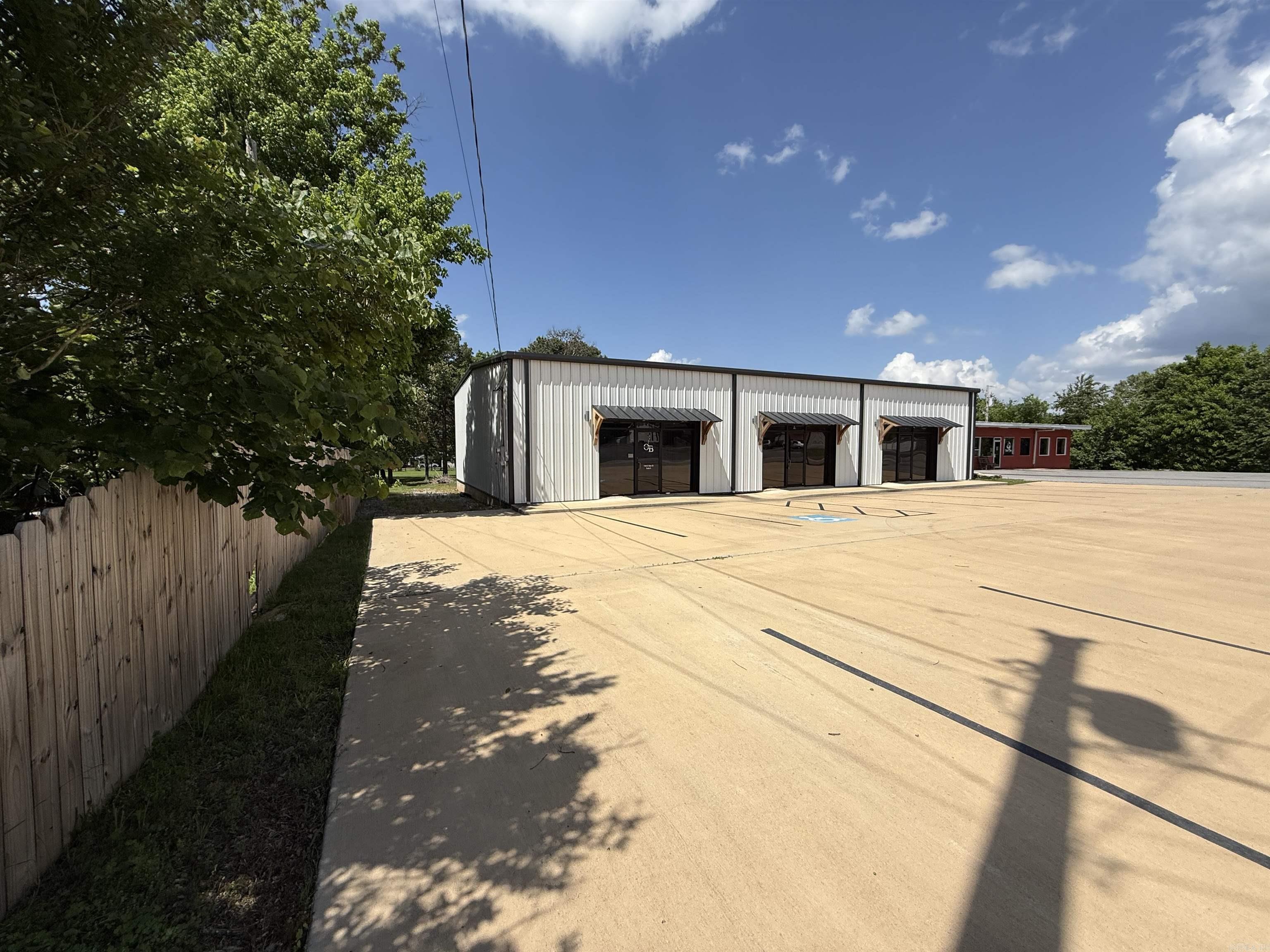 This prime 2,880 sq ft commercial building is perfectly positioned on a 0.71-acre lot, offering outstanding visibility and access. With three bays, the property provides an excellent opportunity to lease out individual spaces or operate multiple businesses from one central location. Whether you're looking to establish a storefront, professional office, or service-based business, this building offers the versatility to meet a variety of needs as a smart and functional investment opportunity. Recently renovated, it features a new roof, upgraded flooring, steel stud construction, and a new AC unit. Combined with quality insulation and high-efficiency utilities, the building is designed for comfort and cost-effective operation. The durable metal exterior and roof add long-term value and require minimal maintenance. A spacious concrete parking lot offers ample space for customers and employees alike. A brand-new survey has already been completed and ready for closing. Priced to sell at only $189,900. The owner is also offering owner financing, making this an opportunity for buyers looking for flexible purchase options. This is a rare opportunity you won’t want to miss.