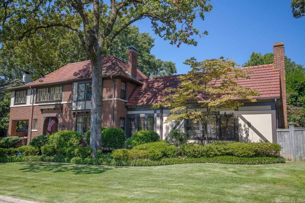 Very special English Tudor with incredible curb appeal on gorgeous, level oversized lot. Porte-cochere w/electric gate and driveway leads to 2 car carport, golf cart parking area and guest house. Covered terrace w flagstone patio, in-ground pool and covered dining area have wonderful spaces for outdoor entertaining. Thoughtful addition and beautiful remodel with special attention to detail. Main House 3,828 SF. Additional 300 SF 3rd floor playroom. Great 600 s.f. Guest House. Quintessential Heights Beauty!