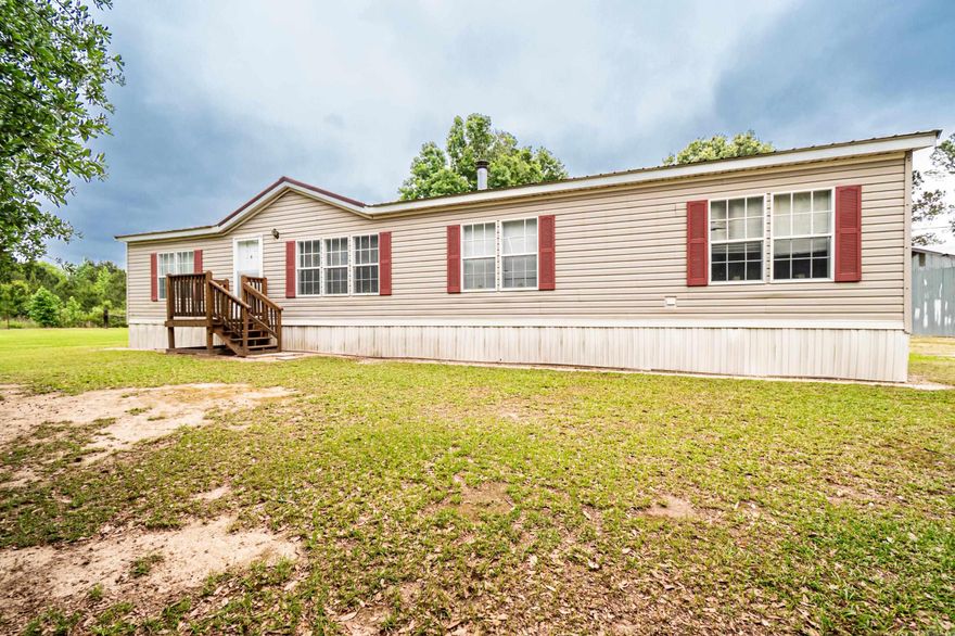 Spacious 4-bedroom, 2-bath mobile home offering approximately 1,800 square feet of comfortable living space! This home features a kitchen with a center island that opens seamlessly into the dining area. Enjoy a living area and a functional layout that includes a laundry room with convenient access to the backyard. Outside, you’ll find a shed along with a separate shop, providing plenty of space for storage and other projects. A great blend of space, functionality, and versatility!”