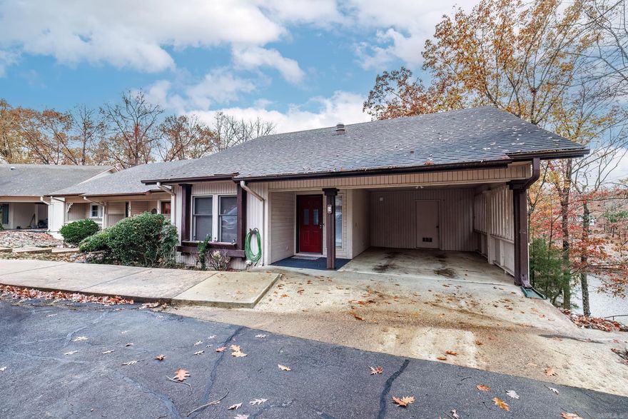 Fully furnished, in demand nightly rental with return business Spectacular lake front townhome in beautiful Hot Springs Village.   This three bdrm 2 bath home features primary suite on entry level with spacious bath and walk-in closet. Entry level include beautifully updated kitchen with granite counters and newer appliances, flooring and fixtures, breakfast nook, dining room, laundry, living room with electric fireplace, and large Arkansas room.  The Arkansas room features a wall of windows looking out over Lake Coronado and a vaulted ceiling giving the feeling of being in the great outdoors. Lower level has two bedrooms, bath, and family room.  Upper-level deck access from nook and dining room.  Lower-level deck accessed from family room.  This unit comes with rare amenity of private dock right outside. One car attached carport with additional parking in front.   Hot Springs Village is a 26000 acre gated community with 9 golf courses, 11 lakes, 50 miles of hiking, pickleball, fitness center, two pool, white sand beach, 2 marinas, and so much more.  All furnishings in home will stay, this has been a lucrative nightly rental and is booked thru April 12. (Spread sheet available)