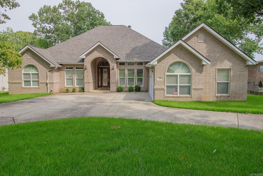 Live on a beautiful area of Lake Hamilton!  This single level home provides ample space for your family.  The primary suite offers separate closet space and separate bathroom space w/ adjoining shower.  For those quiet, special dinners, there is a formal dining room.  Tankless hot water.  Large deck overlooking the lake.  Single boat dock.  Wrought iron fence  offers safety for your pets and/or small children.