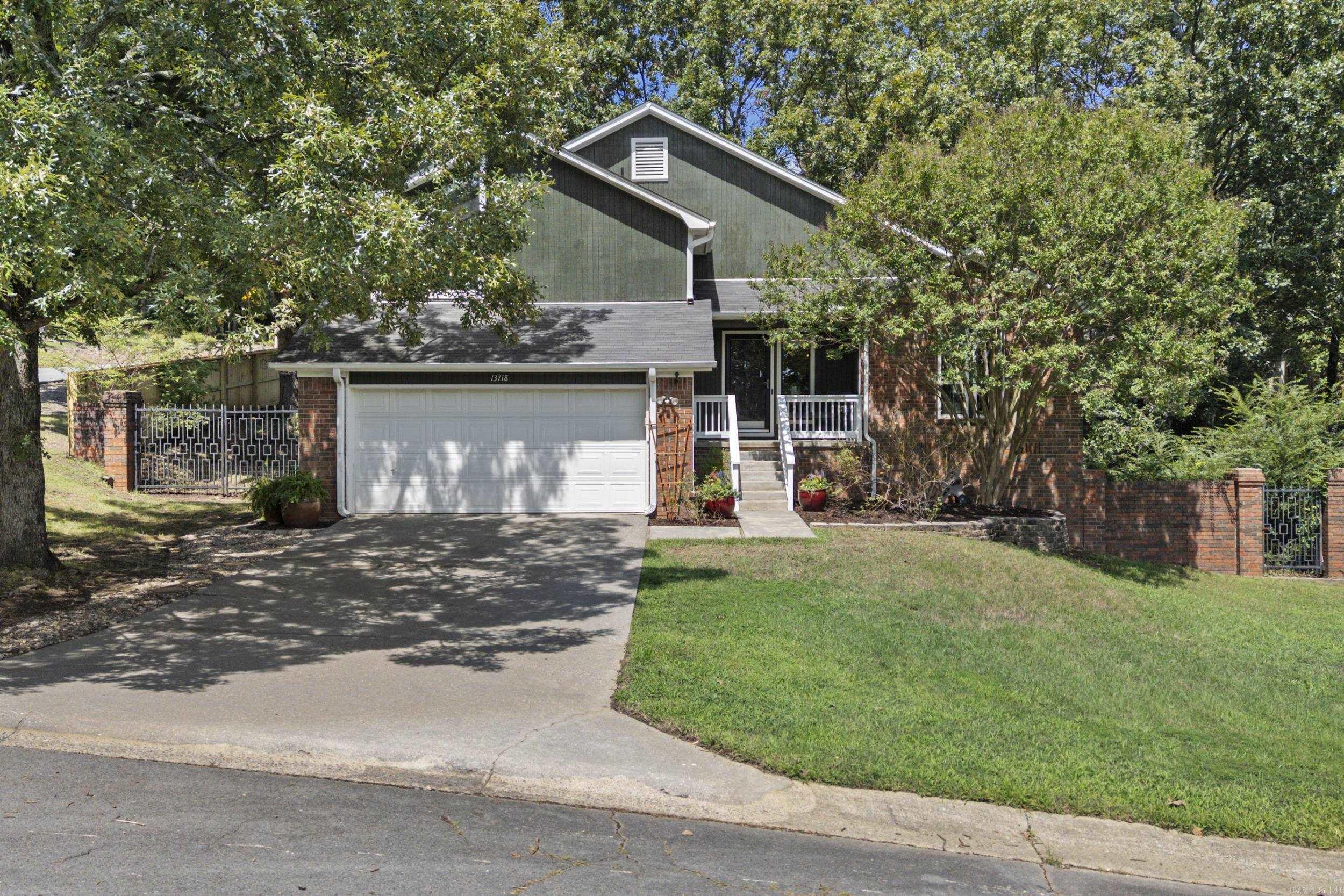 Quality best describes this home located in the popular Parkway/Cedar Ridge neighborhood. This soft contemporary style home offers the perfect blend of classic and contemporary style. Step into the spacious foyer that leads to the vaulted great room that includes a formal dining area with wet bar, fireplace and LVP flooring. Insulated glass doors lead to a screened porch that will wow the most discriminating buyer. A classic white kitchen features tile countertops, island, generous prep space, pantry and breakfast area. Upstairs, you will find 3 spacious bedrooms and 2 bathrooms. The primary suite offers a walk-in closet, vaulted ceiling. This home is perfectly placed on an oversized corner lot. Brick and metal fencing frame this home's curb appeal. Combined with other wood fencing, the back yard is perfect for gardening or entertaining. Location, Quality, Style, Space, Don't miss this one. Please see agent remarks.