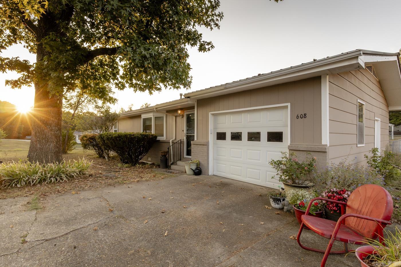 This 2 bedroom 1.5 bathroom home sits on two lots with city conveniences. There is a dedicated laundry room with lots of built-in storage. Living area has updated luxury vinyl plank flooring. An attached garage, metal roof, covered deck and fenced backyard are great features of this home.