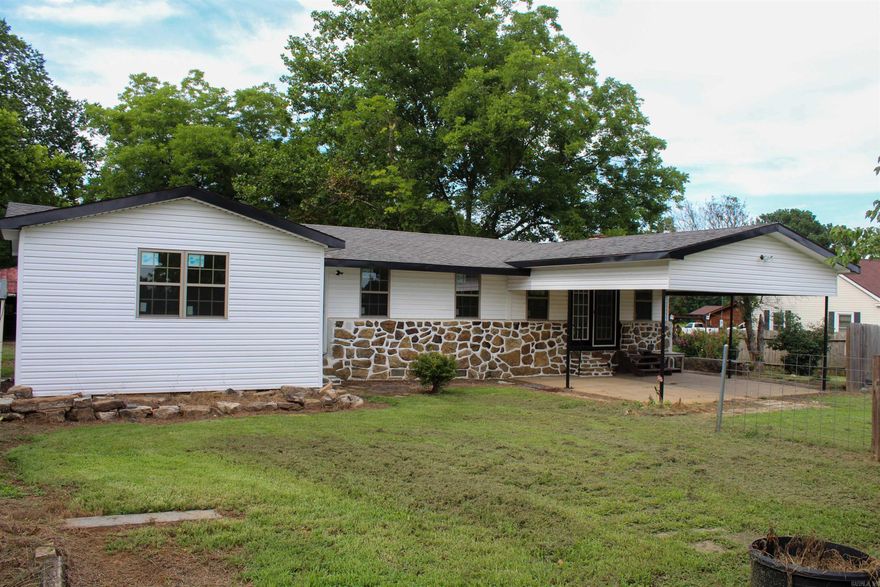 Experience the best of both worlds, peaceful country living just outside city limits while still being conveniently close to town. This beautifully remodeled home sits on a clear, level one-acre lot and is located just a few miles from downtown and less than 5 minute drive from the Dardanelle School District. The home features 3 bedrooms, 1 full bathroom, and a spacious open-concept layout where the living room, kitchen, and dining area blend seamlessly, creating a warm and inviting space. You'll also find a dedicated laundry area and a concrete carport for covered parking. One of the standout features of this property is the large outbuilding, offering endless possibilities for storage, a workshop, or hobby space. If you're looking for space, privacy, and convenience, this property checks all the boxes. Don’t miss your chance to own this well-maintained home with plenty of room to grow and make it your own! Call 479-324-2879