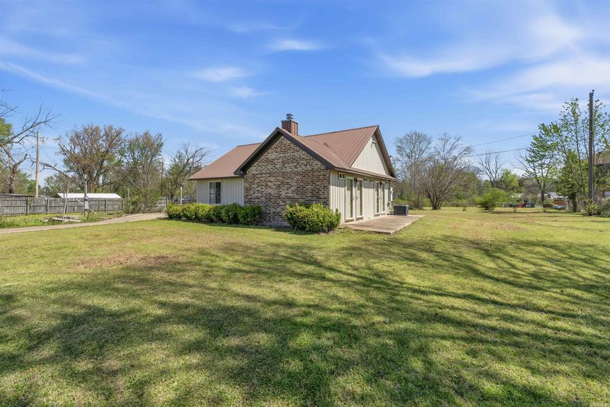 Welcome to peaceful country-style living with room to breathe! Charming home on a spacious lot offering privacy and peaceful surroundings. This home is equipped with a metal roof and a large backyard with plenty of room to enjoy the outdoors. The structure’s solid construction and metal exterior contribute to long-term durability and easy upkeep.  Inside, the kitchen is equipped with granite countertops, stainless steel appliances, and an abundance of cabinets for extra storage. Continuing your tour, you will find a simple, efficient floor plan with natural light from elevated windows, offering both privacy and brightness.   The extended patio area just off the back provides the perfect spot for grilling, outdoor dining, or enjoying peaceful mornings and evenings. Conveniently located with a quiet, country-style feel, yet still close to town amenities.  Why rent and be close to others, when you can own your own home with room to spread out?! Come and take a look today!