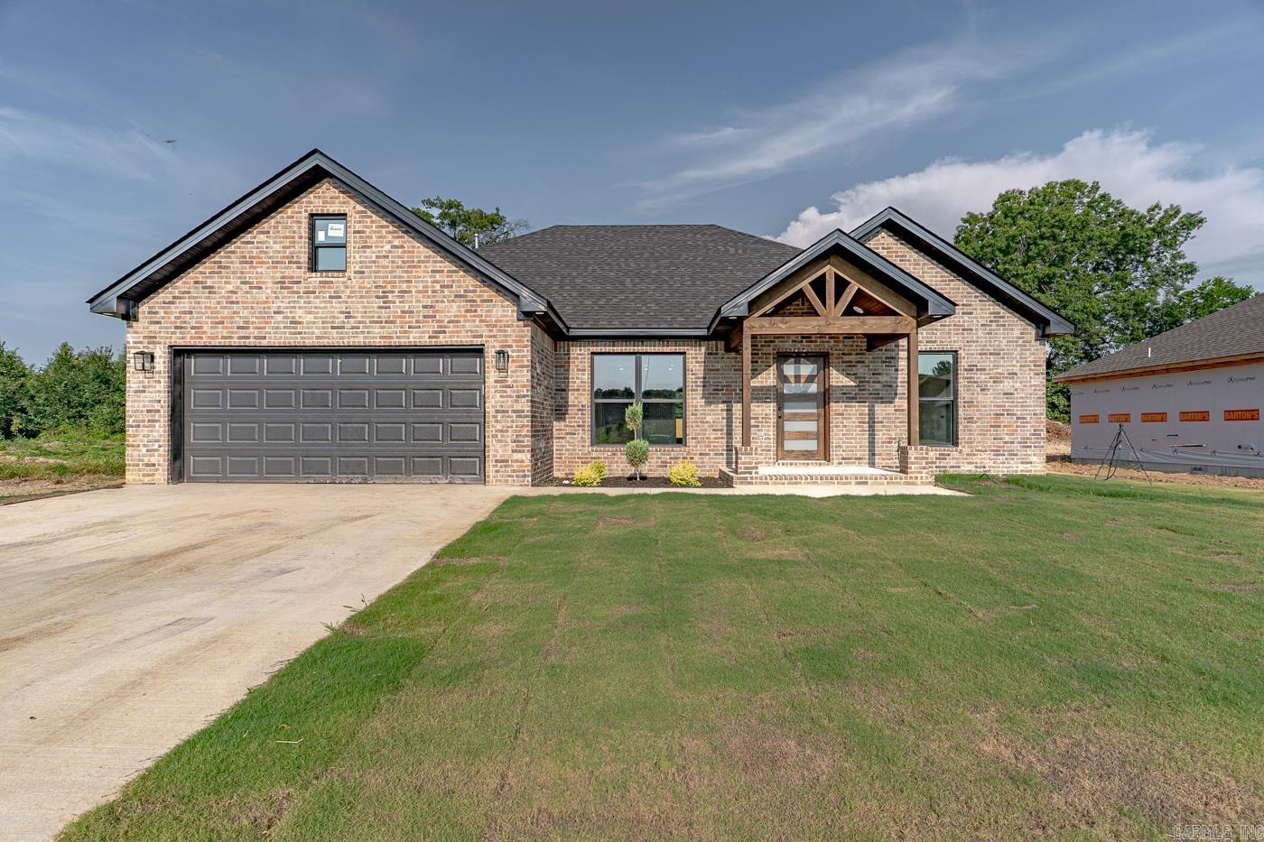Welcome to Market 233 Woodland Trail in Bono, AR! Stunning New all-brick construction featuring 3 bedrooms and 2 full baths with custom walk-in shower in master bath. You will find beautiful laminate flooring throughout. Open-concept layout with an electric fireplace in the living area with custom shelves & mantel. Well-equipped beautiful kitchen comes with a gas stove, farmhouse sink & breakfast island. Step outside to a covered back patioāperfect for relaxing or entertaining. Move-in Ready! Come see today!