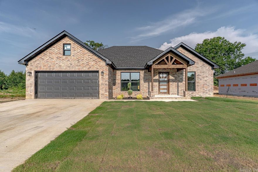 Welcome to Market 233 Woodland Trail in Bono, AR!  Stunning New all-brick construction featuring 3 bedrooms and 2 full baths with custom walk-in shower in master bath.  You will find beautiful laminate flooring throughout. Open-concept layout with an electric fireplace in the living area with custom shelves & mantel.  Well-equipped beautiful kitchen comes with a gas stove, farmhouse sink & breakfast island. Step outside to a covered back patio—perfect for relaxing or entertaining. Move-in Ready! Come see today!