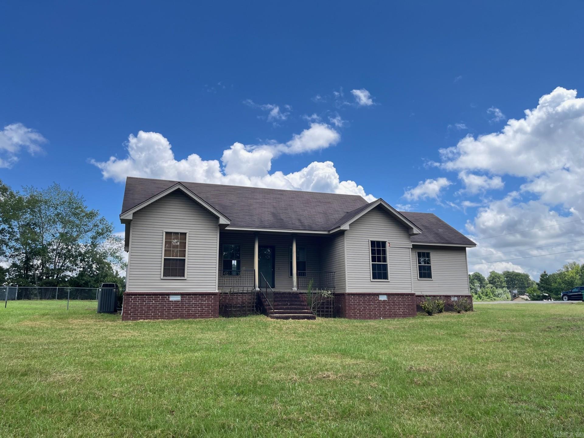 This 3-bedroom, 2-bath home offers space, privacy, and potential. With a detached 2-car garage and a fenced yard on a large, level lot, there’s plenty of room to make it your own. Inside, you'll find a spacious kitchen with ample cabinet and counter space, a primary suite with double vanities, a walk-in shower, a walk-in closet, a soaking tub, and charming architectural details like interior columns and large windows for natural light. The home is being sold as-is and does need some TLC including new carpet, deck repair, and other updates. The home is priced to reflect the needed repairs. Quiet setting with easy access to town—bring your vision and make this one yours! Home is being sold "as is".