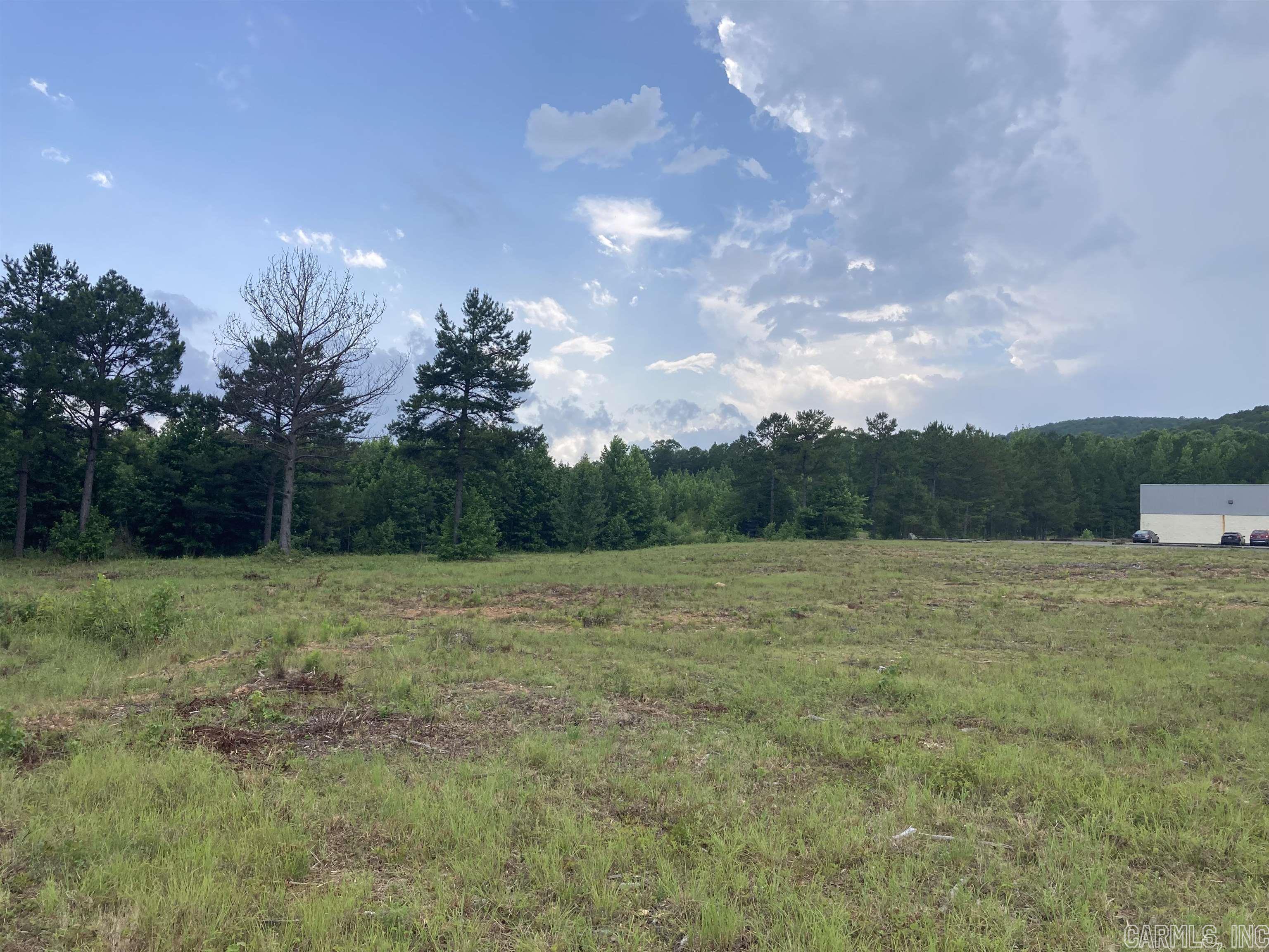 Flat commercial property, completely cleared and ready to build. Two parcels containing 1.73 acres. Property is located in front of the bowling alley and across the street from auto parts store. Extremely high traffic area.