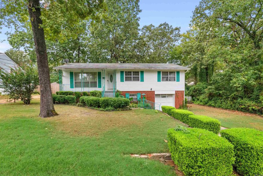 One owner home in the heart of Sherwood.  You can't beat this location.  As you enter you are greeted by a large living room with lots of natural light streaming in.  The original hardwood floors are under all of the carpet in the living room, hallway and 3 bedrooms.  The bedrooms are all a nice size.  The primary bedroom has a walk-in closet which is rare for this age home.  The kitchen has newer counter tops, backsplash and stove.  They have added a room onto the backside of the home for added convenience of a main floor laundry and den.  Downstairs you will find another family room with wood-burning fireplace and the original laundry room.  This could easily be converted to another bathroom if needed.  Come put your stamp on this great home.  The backyard is huge!  Call today for a showing.