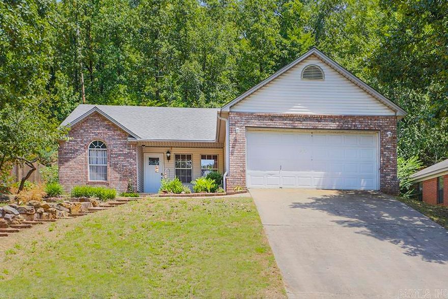 Wonderful home located in the heart of Lakewood within walking distance to the lake and park. Incredible custom updates throughout. Kitchen is gorgeous and has new tile countertops, backsplash, sink, floors, travertine arch, chair rail and other accents, new stove and refrigerator. Primary Bedroom is beautiful with new bamboo flooring and Bath with heated jacuzzi tub, new tile shower, granite countertops and new sinks, travertine accents, new tile floors and new toilet. Two additional Bedrooms share pretty Guest Bath remodeled with new travertine countertops, sink, new toilet and new tile floor. Extensive stunning outdoor landscaping including retaining walls, tiled patio, pergola, large woodburning oven, raised garden beds, stone terrace landscaping in front yard and side yard. Retaining wall in back yard is custom design with hand cut limestone. Join Lakewood POA and enjoy fishing, boating, tennis, and swimming. Great neighborhood! Newer home in more established area. Come see!