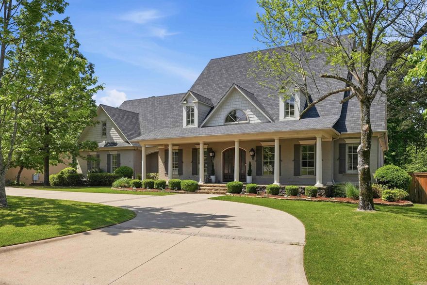 Behind the private gates of Germay Court, this Kevin Hughes custom home is positioned on the 5th fairway of the Bear Den Golf Course, offering an oversized lot and cart-path access to Chenal Country Club. A charming front porch welcomes you inside to the foyer that is anchored by an office w/ oak-stained woodwork & built-ins and a formal dining room w/ a nearby wet bar. The great room features a gas fireplace with Italian marble mantle, built-ins & access to the covered back porch. The remodeled gourmet kitchen includes fresh updates and premium appliances, making it a chef’s delight. Additional main-level features include a breakfast area, pool bath, half bath, pantry w/ coffee bar, laundry room & mudroom. The main-level primary suite is a peaceful retreat & includes an ensuite bath with dual vanities, a jetted tub, walk-in shower, water closet & walk-in closets. Upstairs offers a game room w/ kitchenette, hangout room, guest suite with private bath & 2 additional bedrooms that share a hall bath. The backyard is designed for entertaining with covered & open patios and a renovated gunite pool & spa. A three-car garage, workshop, and circle drive complete this exceptional property.