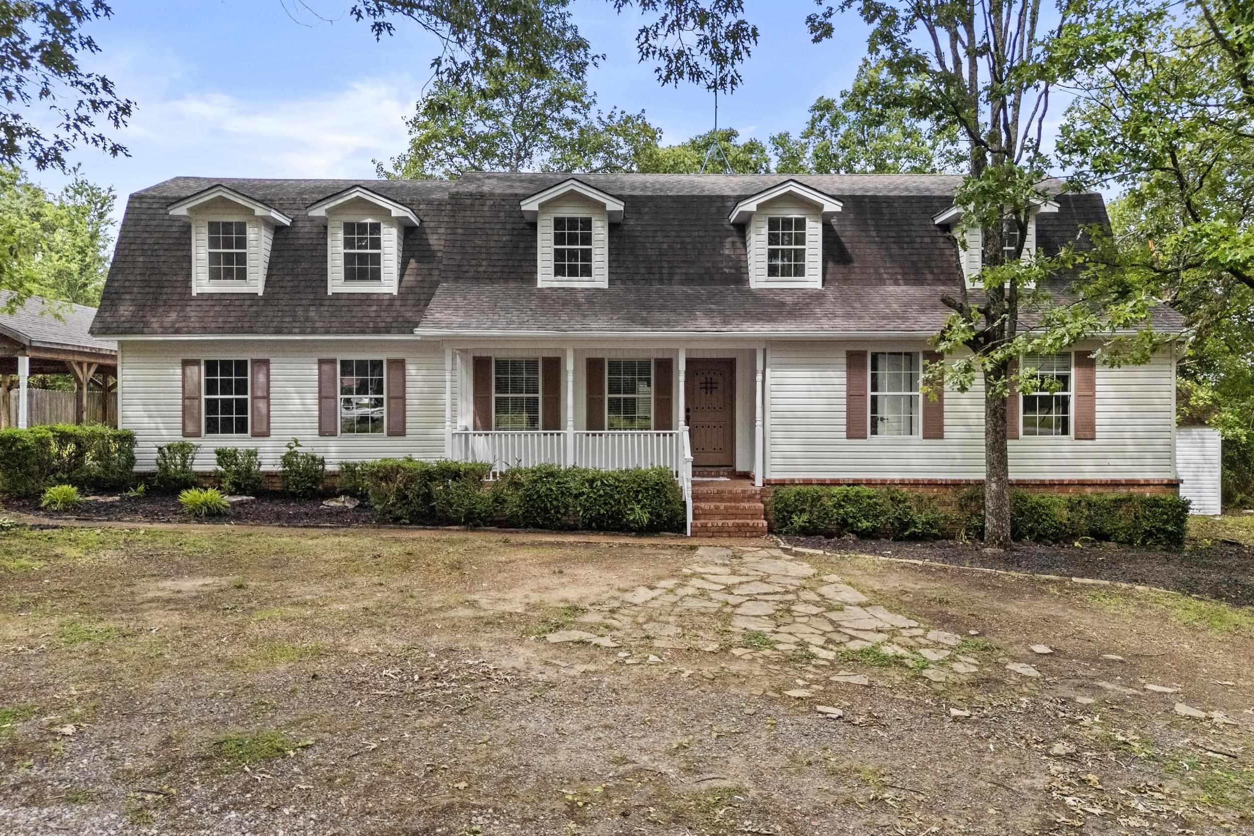 **Sellers will install a NEW ROOF and NEW DISHWASHER with acceptable offer!** Enjoy country living just minutes from the city! This 5 bedroom, 3 bathroom farmhouse features a unique gambrel roof, open kitchen, and plenty of space to relax. The 5th bedroom can be used as a large bonus area. Additional spaces include two laundry areas (one on each floor), a large carport perfect for outdoor entertaining, and a storage building ideal for a shop or extra space. Roomy, peaceful, and full of potential!