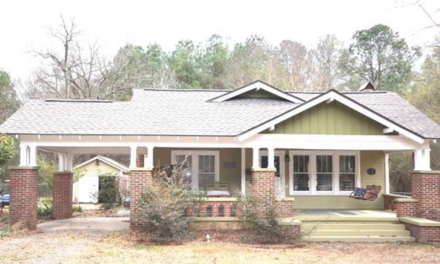 Home on acreage in rural Magnolia area close to town.