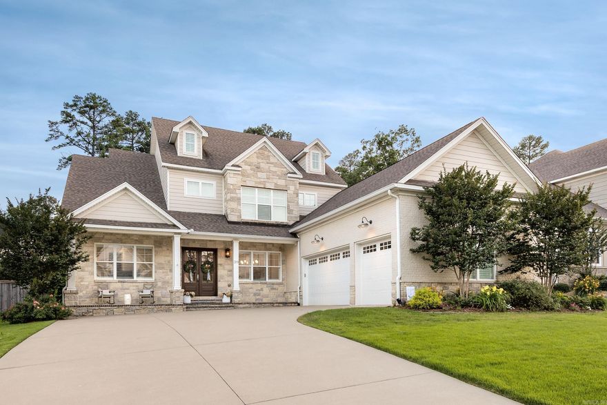 Discover refined living in the heart of Chenal Valley with this exceptional home offering direct cart path access to Chenal Country Club. The main living area impresses with soaring ceilings, a striking rock fireplace, and custom built-ins that flow into a chef’s kitchen featuring a large pantry and gourmet finishes. The main level includes two bedrooms, including a luxurious primary suite with dual closets, a formal dining room, and a spacious laundry/mud room. Custom plantation shutters throughout add timeless elegance. Upstairs you’ll find three additional bedrooms, two full baths, and a versatile bonus room. Enjoy year-round outdoor living on the covered patio overlooking a private, tree-lined backyard—perfect for relaxing or entertaining. This home blends elegance, functionality, and a coveted location for the ultimate Chenal lifestyle. Green space behind the home and easement on the left side of the home. DON'T MISS THIS ONE!