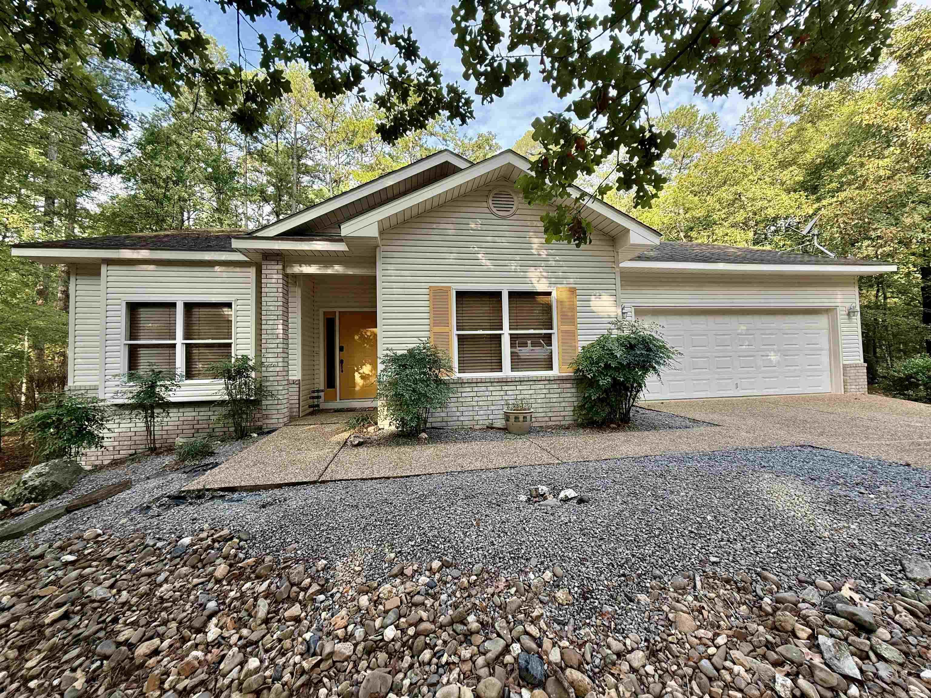 Discover comfort and convenience in this beautiful 3-bedroom, 2-bath home tucked into a serene wooded setting. Built in 2005, this light-filled residence offers an open floor plan that blends style and function, perfect for both relaxing and entertaining. Step inside and you’ll find: Luxury vinyl plank flooring, inviting kitchen, clean and well kept home throughout. Low-maintenance landscaping so you can spend more time enjoying life. Just a short walk away, you’ll find the Coronado Golf Course and Lake Coronado. While nestled in privacy among the trees, you’re still only minutes from dining, shopping, and recreation. This move-in ready home truly has all the bells and whistles—the perfect balance of modern living and natural beauty.