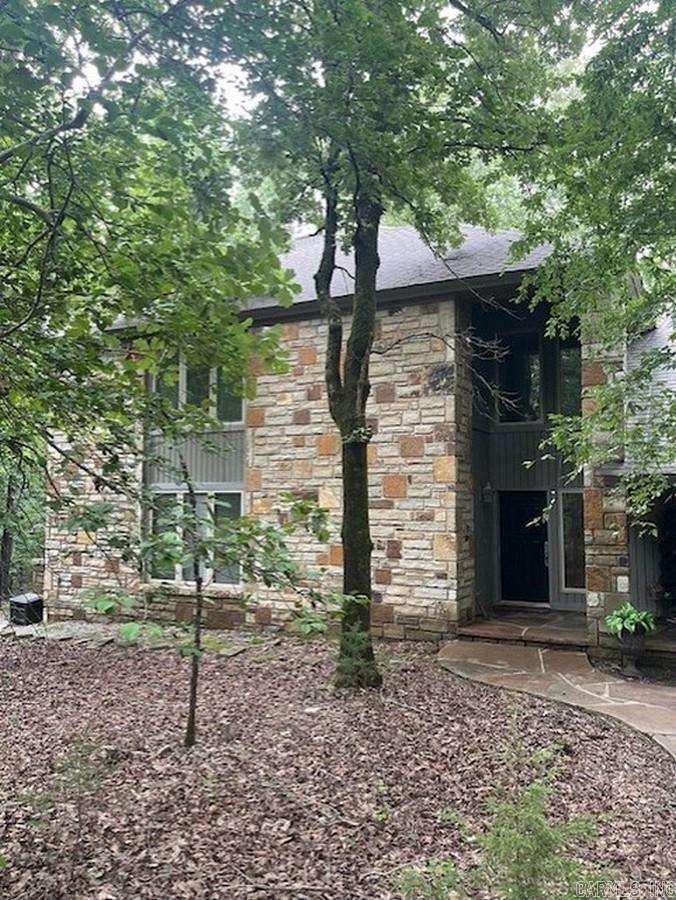 Beautiful Lake Ouachita off Twin Creek Rd. Free public boat ramp. Private boat ramps 1.5 miles. 21 acres m/l. Land borders Core property to take on 2 sides. Many hardwoods, Dogwoods. Spring fed creek & old silver mine on property. Buildable house sites. Underground electric. Approx. 3,000 sq ft built 2000. 4 bedrooms, 2 full bathrooms and 2 half bath. Separate bedroom and 1.5 bath above garage. Geothermal heat and air & floor heat. Generac propane generator. 20 foot ceiling in great room. Large hearth stone fireplace with Extraordinair blower. Outdoor kitchen and large wrap around deck with composite floor deck. Hot Springs brand hot tub new Spring 2024. Shop 20ft and 30ft. bathroom, 8ft/10ft. 3 garage doors, 2 front 1 back. 2 exterior doors in shop. 3/10 mile asphalt private entry drive with security gate.