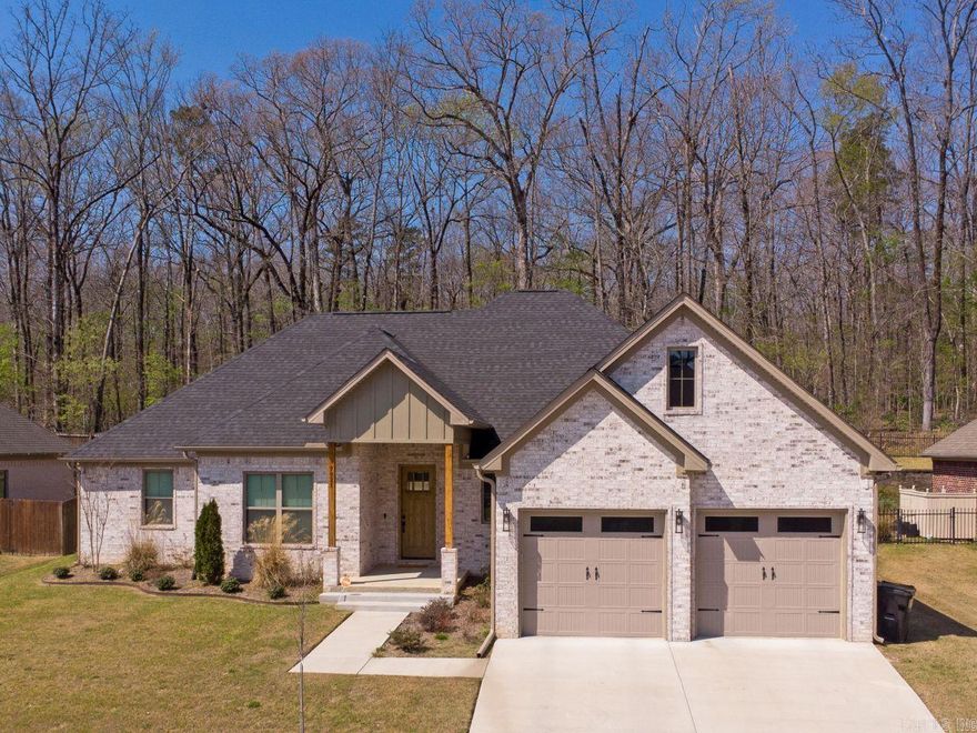 Come see this beautiful home in the prestigious Hurricane Lake subdivision, nestled on South Shoreline Blvd. in Benton, AR. This home was built in 2024 and is immaculate! With attention to detail in both the interior and exterior styling, pictures don't do it justice. Walking into the front door, you're greeted by beautiful hardwood flooring, plenty of natural light, a fireplace, and beautiful built-ins with light wood accents. Paired with beautiful quartz countertops in the kitchen, an island to accommodate your guests, and access to the mudroom, this layout is a must-see. The master bedroom is spacious with tray ceilings and a large master bathroom. The oversized laundry room and pantry just make this home even more perfect. You've got to check this one out today!