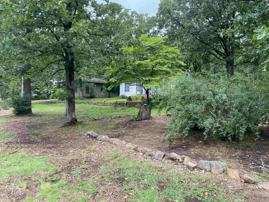 1.65 Acres! Mature trees! Goes all the way to 58th!  2 residences on the property. Both need to be torn down and then you could rebuild!  Property has been in the same family since it was built. Lots of wonderful memories were made on this land. See agent remarks. If reading the Zoning map correctly it is zoned C3