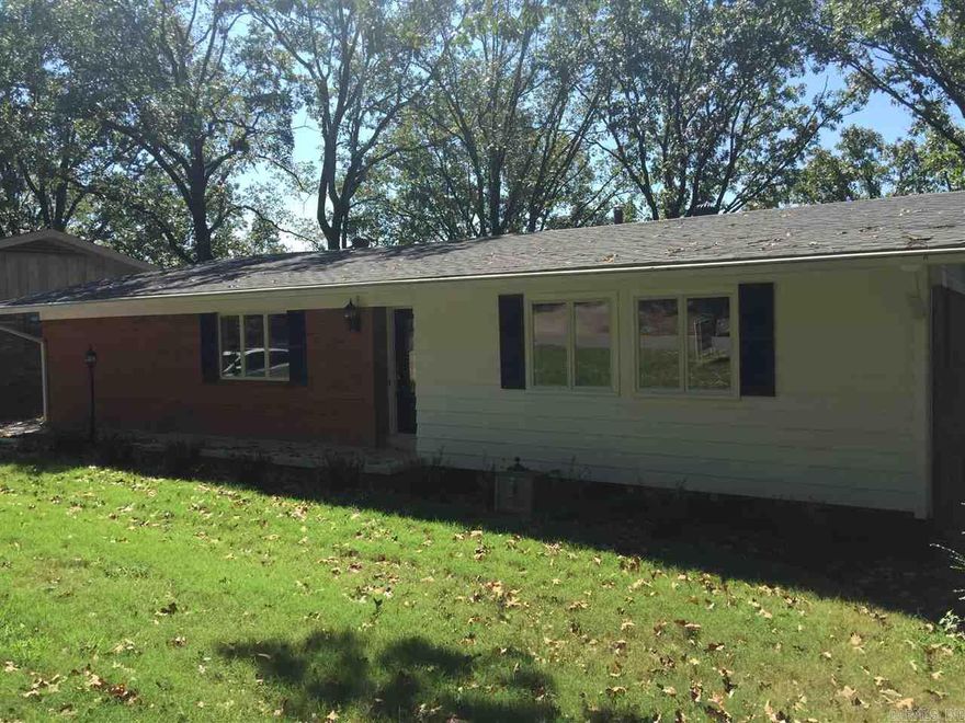 REFANTASTIC FIVE LARGE BEDROOM HOME!!! THREE FULL CUSTOM BATHS!!!  AWESOME remodeled home in the heart of the city!  Beautiful natural hardwood flooring…open floor plan with tons of natural light…new roof, flooring, cabinets, granite countertops, stainless appliances, custom lighting, etc.  Several bonus rooms and custom triple paned windows.  OUTDOOR LIVING AT IT’S BEST!!!  Includes a sunroom, an oversized covered deck, 3 LARGE stone patios, setting on .45 acres, which includes extra lot.  GREAT VIEWS!!!