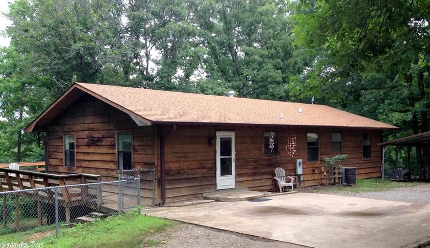 RARE 5 bedroom home close to Lake Hamilton schools. At the end of the road, this Cedar sided home on over an acre has a 570sf wooden deck overlooking pasture and woods.  Main level has new laminate flooring, 2 beds, 2 updated baths plus cooled enclosed porch - not included in sf.  Newer appliances, fresh paint, nice window treatments.  Down- 3 beds, one very large with cedar closet, living area, updated bath and large kitchen dining area with $4,500 ALLOWANCE FOR FLOORING & APPLIANCES with acceptable offer!