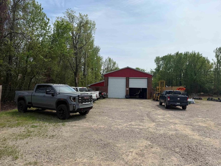 EXCELLENT COMMERCIAL LOCATION IN LAMAR JUST A STONES THROW FROM THE GREENBRIAR CREEK BRIDGE ON HWY #64/MAIN STREET WHICH SEPARATES THE CITY LIMITS OF LAMAR & CLARKSVILLE. HAS 15'X40' NEW ENCLOSED METAL BUILDING WITH A MAN-DOOR & GARAGE DOOR ON IT. EXISTING SHOP BUILDING IS ROUGHLY 32FT X 92FT X 16+ TALL EXISTING ATTACHED OFFICE BUILDING IS 10 FT X 61 FT