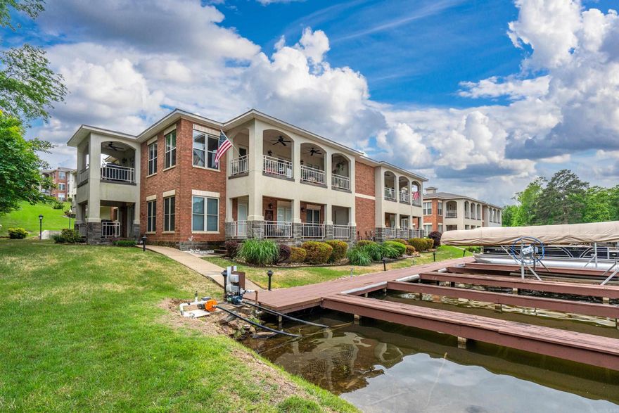 Lakefront living just leveled up on Lake Hamilton, this one is a rare find. Welcome to 518 Amity Rd in the gated Millennial bay community, where elevated design meets effortless waterfront living.  This beautifully appointed 2-bedroom, 2-bath condo sits next to a wooded area for added privacy and showcases stunning lakefront views,  a spacious layout, and upscale finishes throughout. Inside, a TWO inviting gas fireplace, abundant storage, and a seemless flow that balances everyday comfort with elevated entertaining. This space feels both sophisticated and relaxed, perfect for those who appreciate quality and ease. Step outside and experience true lake lifestyle, complete with your boat dock steps away from your condo. Complete with a private garage and dedicated boat storage,  a rare feature that sets this property apart.  Residents also enjoy access to a community pool and clubhouse. Perfect day here might begin with coffee overlooking the water, followed by boating and end with dinner and entertainment just minutes away in Downtown Hot Springs, along historic Bathhouse Row or at Oaklawn Racing Casino Resort. *washer, dryer, refrigerator stay.  Some furnishings negotiable.