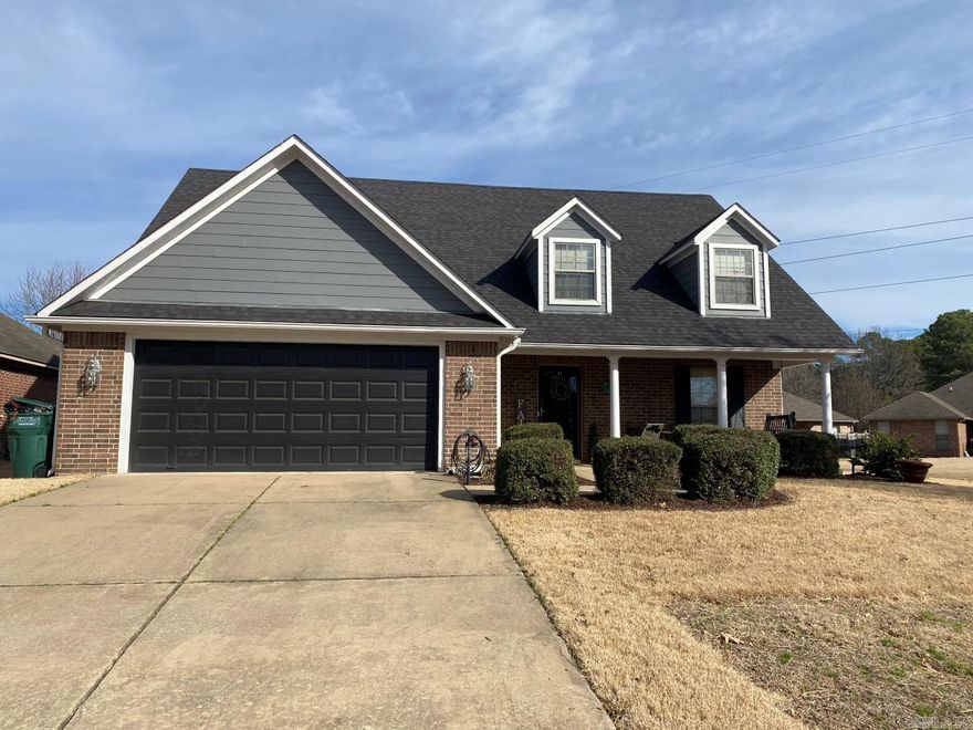 Rare find in highly sought school zone. Brick & hardy board exterior, craftsmen style, 2 story on .37 level lot, Architectural roof new 2018, fully fenced, front porch with swing, covered plus extended rear patio, city maintained lot at right of home adds privacy & play area, downstairs: half bath, coat closet at entry, laundry, eat-in kitchen, spacious den, master suite w/ dbl vanity, walk-in shower, jetted tub, walk-in closet, luxury plank vinyl flooring. Upstairs Berber carpet, guest rooms, full bath.