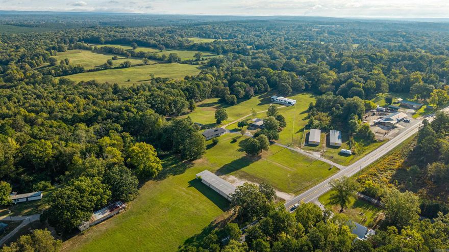 THIS GEM IS A RARE FIND! INCOME PRODUCING INVESTMENT OPPORTUNITY MINUTES FROM LAKE DEGRAY;  Currently has 50 storage units at 95% occupency with plenty of room to add much needed and high demand boat storage.    2 LARGE Homes, massive shop ,2 wells on   Hwy 7 frontage, on 17.94 +\- acres, in addition there's a concrete pad with a seperate address to accommodate a large RV or small mobile home. will cash flow from day one.