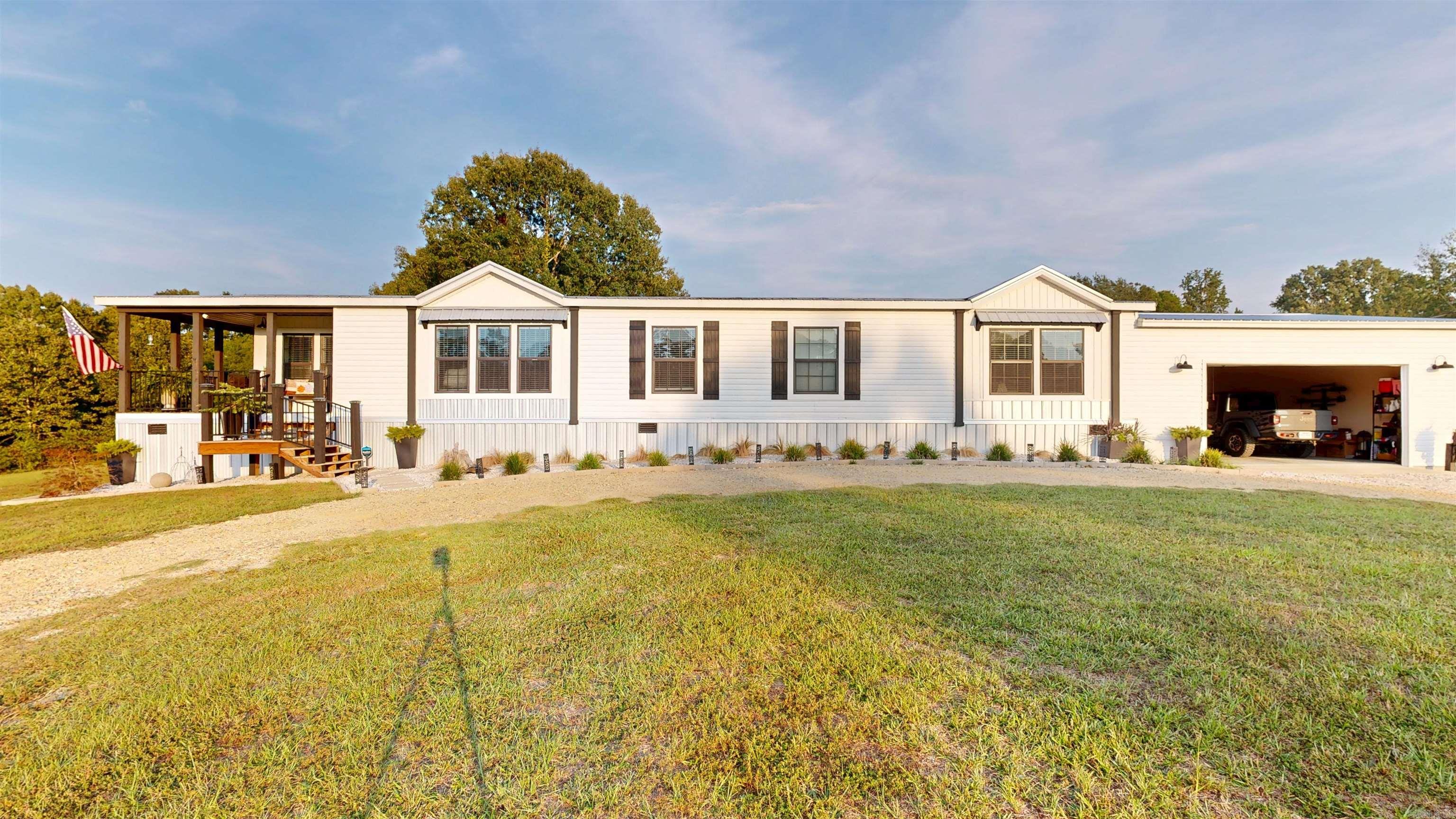 THIS GEM IS A RARE FIND! It would be an awsome multi-generation family homestaed with an income or a perfect Investment property with 2 large homes, massive shop, and 50 storage units, currently at 95% occupency, Hwy 7 frontage, on 17.94 +\- acres, in addition there's a concrete pad with a seperate address to accommodate a large RV or small mobile home. will cash flow from day one with lots of room to expand. It's minutes from beautiful DeGray Lake! This property includes: (1) an HGTV ready custom manufactured home on concrete footers, built in 2023, with 2137 sq ft, 3 bedrooms, 2.5 bath, extra large master suite with an incredible en-suit bath, huge custom walk-in closet, laundry room, mud room, coffee bar, covered front porch and rear patios, direct wired Generac generator and a massive 2 car garage. (2) A Brick home with open floor plan, custom kitchen cabinets, updated appliances, 2 full baths, and large hallway. This home feels much larger than 1600 sq ft! It also includes a large laundry room/storage room, covered rear patio with an outside counter and sink and a 2 car garage. It has been freshly painted inside and out, with upgraded electrical wiring, new roof in June 20