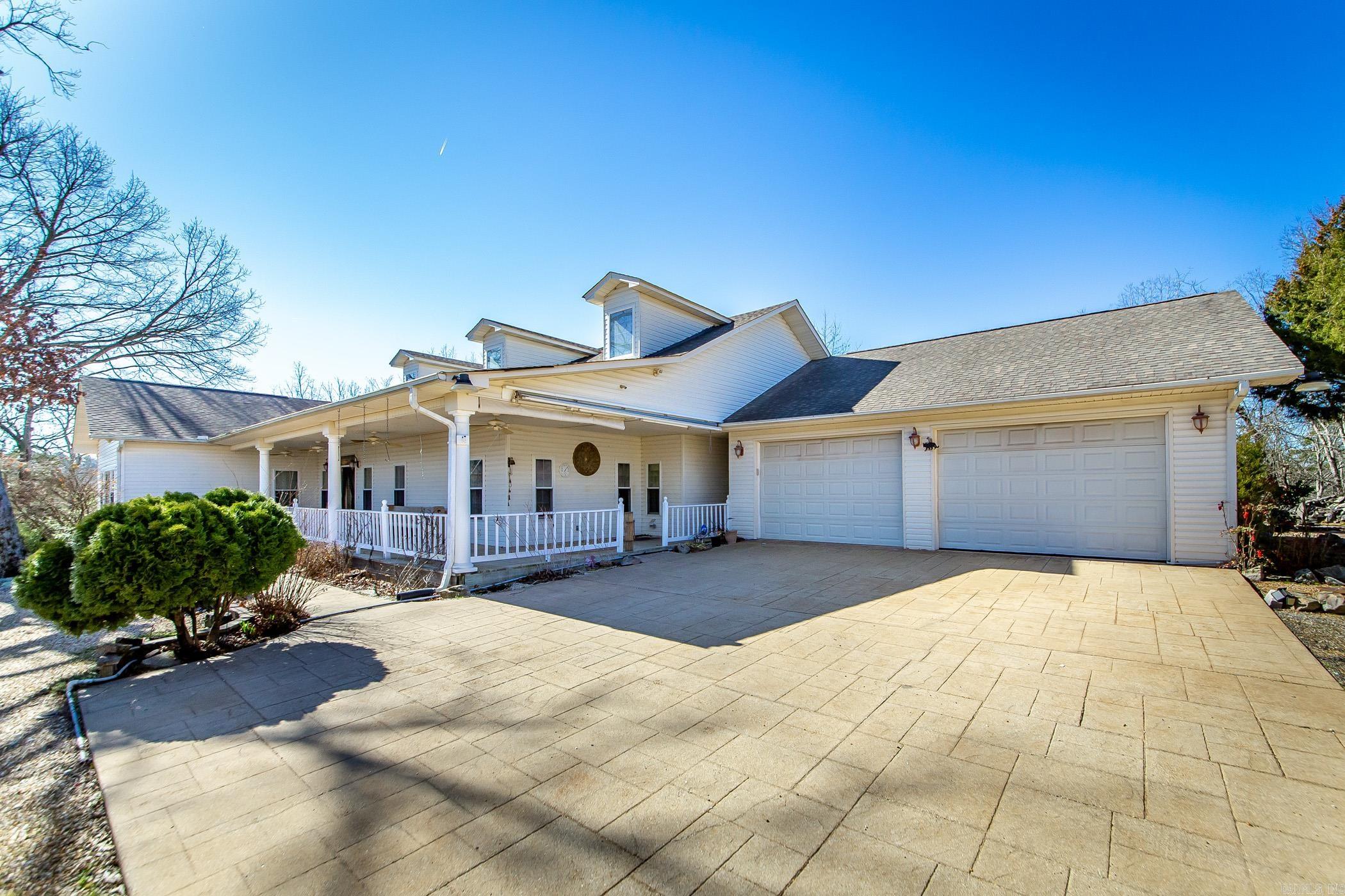Looking for a beautiful home with 4 additional buildable locations, w/ utilities in place, for a family compound? This 3112sqft home sits on 16.78 acres and comes with an additional parcel with 3.13 acres with foundation done and ready for a build out. The home itself boasts spacious rooms, open great room, breakfast nook, formal dining room and large covered back porch ready for entertaining. Off the back porch is a rock fountain for a beautiful, relaxing setting. Main bedroom with ensuite also has an attached sunroom with hot tub. Ready to soak and sip then slip into bed! One room has a desk built in and Murphy bed for guests. There is a shop that can be used for just about anything you can imagine. Low maintenance yard for easy upkeep. Take advantage of being minutes away from Oaklawn, Bath House Row and all the other amenities of Hot Springs while being in a peaceful location outside of town.